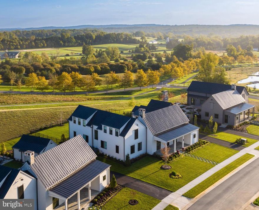 Set against 200 acres of protected conservation land, 604 Martingale Ridge Drive offers a rare balance of privacy, design, and ease within the exclusive Residences at Salamander. Just over an hour drive from Washington, DC, the home is oriented around light, landscape, and indoor–outdoor living, with floor-to-ceiling windows framing a private courtyard, pool, and garden, and long views beyond. It is a residence designed for effortless weekends and extended stays—refined, tranquil, and seamlessly connected to one of Virginia’s most celebrated resort destinations.  

The exclusive Residences at Salamander were conceived by Sheila Johnson to be an intimate collection of luxury homes woven into the celebrated 340-acre Salamander Middleburg resort. Surrounded by protected woodlands, streams, and miles of riding, walking, and biking trails, the property offers rare privacy with sweeping pastoral views and a Blue Ridge Mountain backdrop, all just moments from the charm of downtown Middleburg. City meets country in a most sophisticated yet casual way.  The walkability to both the Resort , the spa, along with all the shopping and restaurants in charming town of Middleburg make this a singular retreat. 

Upon entering the home, you are greeted by a dramatic great room crowned by a soaring 16-foot cathedral ceiling with wood beams. Instantly, your eye is drawn upward—and then outward—to a glorious courtyard enclosed by the wings of the house, with 200 acres of protected woodland beyond. You hardly know whether to step inside or out; it is all so lovely. Back inside, the great room is beautifully articulated into a living area with fireplace, a dining space overlooking the professionally landscaped courtyard, pool, and garden, At the far end is the elegant breakfast bar and behind a gourmet kitchen with everything you need. Everyone can gather here, yet the room offers countless places to settle in and enjoy the space. Custom details include wood ceiling beams, a handsome dry bar with wine refrigerator, and refined designer lighting throughout.

The first floor also features a fireside den with full bath and a serene primary suite with direct access to the pool, spa, and private courtyard and another guest space. Upstairs, two light-filled ensuite bedrooms offer enhanced ceiling heights and a charming reading-nook landing. The lower level includes two additional bedrooms, two full bathrooms, and a very large generous, flexible media and game room ideal for entertaining, also there is connected storage room.

The outdoor courtyard is a world unto itself, with inviting spaces to dine, read, lounge in the sun, or dangle your feet in the pool. Outdoor amenities include a large heated saltwater pool and an 8' x 8' spa. The current owners converted the garage into a carpeted pool house for lounging, hosting a party or making it a small bedroom; as it is equipped with full bath. The multiple stone terraces, a grill center, and the ease to walk the resort property from your own back yard is sublime. With six bedrooms and seven-and-a-half baths, this is an unparalleled opportunity to experience luxury living at the Residences at Salamander, along with full access to the amenities of the Salamander resort in one of Virginia’s most celebrated destinations.