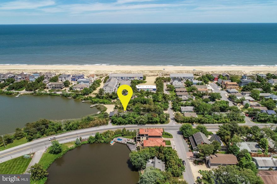 Silver Lake front oasis just steps from the beach in the highly desired community of Rehoboth By The Sea. This incredible beach house situated on an oversized building lot (14,077 sf) offers 6 bedrooms, 3.5 baths and a magnitude of charming features including hardwood floors, vaulted ceilings, exposed beams, skylights, wood paneling and a brick wood burning fireplace. The amazing outside spaces include a spacious waterfront screened porch and sun deck that leads to your own private sandy lake beach. This property offers water access perfect for paddle boarding and/or kayaking on Silver Lake. Additional exterior features include an outside shower, two private parking areas (5 spaces), and expansive storage room for bikes, kayaks, paddle boards, etc. This property is one of the few that fronts directly on Silver Lake, while only being steps from the ocean with excellent proximity to all of the amenities of Rehoboth & Dewey Beach.