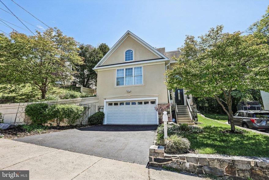 Welcome to 208 Jefferson St. in Belmont Hills, Bala Cynwyd.  This beautifully well-maintained single family contemporary home offers 2,546 sq. ft. of stylish living space with 3 bedrooms, 2 full baths and 2 half baths. 
This home combines comfort, functionality, and modern convenience with features including a smart 2-car attached garage door, smart thermostat, central vacuum system, and abundant storage throughout.  Recent improvements includes fresh interior and exterior paint, a newly resurfaced driveway, hot water heater less than 5 years old and a 2 zoned HVAC sytem that is less than two years old.
Step inside to an impressive first floor featuring soaring ceilings in the foyer and living room, creating an open and airy feel. The spacious living room is filled with natural light from oversized windows and showcases hardwood floors amd a cozy gas fireplace.  
Just a few steps up , you'll find a bright and spacious eat-in kitchen with granite countertops, ceramic tile flooring, gas stove, ample cabinetry, and updated appliances including a new dishwasher and refrigerator.  Flowing seamlessly from the kitchen is a large dining room with an adjoining bonus space ideal for a home office, sitting room, or flex space.  French doors lead to a private patio perfect for outdoor dining, entertaining, or relaxing.  A convenient powder room completes this level.
The upper level offers three generously sized bedrooms, including a spacious primary suite with a private bath and walk-in closet.  Two additional bedrooms features ample closet space and shared full bathroom.  A conveniently located laundry nook is also on the level.
The finished lower level expands your living space with new laminate flooring, a large open recreation area, built-in bar, half bath, and additional storage.  This versatile space is ideal for entertaining, a media room, home gym, or playroom.  Direct access to both the side yard and attached 2-car garage adds convenience.  The garage and crawl space, walls and flooring have all been freshly painted.  
This Belmont Hills home is move-in ready with contemporary style, generous living space and modern upgrades in a prime location.
Schedule your private showing today!