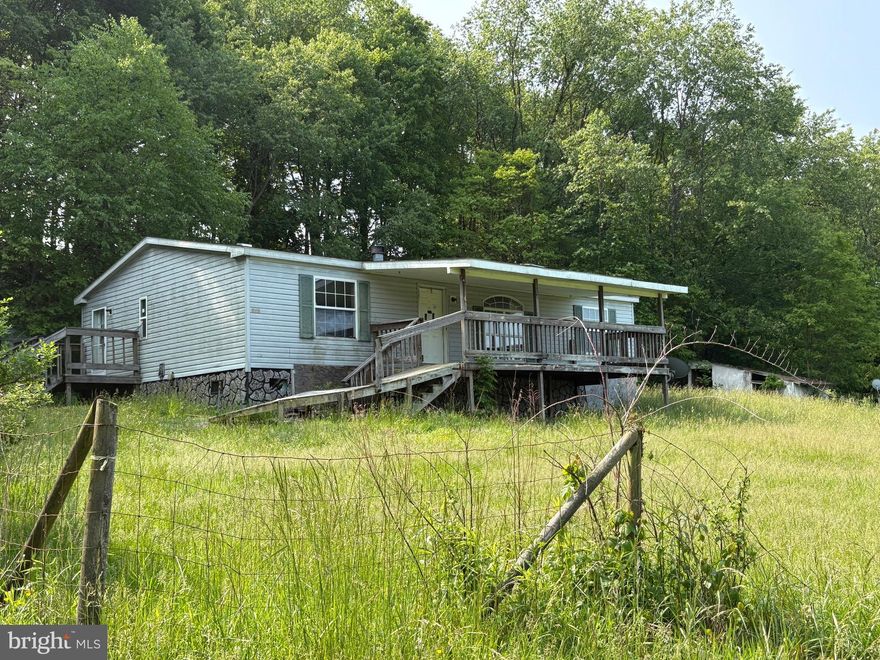 3 BR, 2 full bath manufactured home situated on 2.28 acres, with no HOA . Lot is mostly cleared , country setting , easily accessible.  Home needs work, but has lots of potential . Perfect project for a handy person or investor.