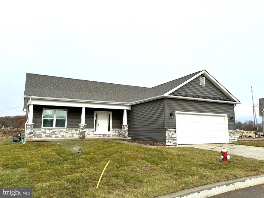 Under Construction..... 1440 sqft Ranch Home featuring Natural Gas heating, open floor plan design with vaulted ceiling and gas fireplace in Family Room, LVP Flooring throughout main living areas, Kitchen with island, granite countertops, and stainless steel appliances, spacious family room, and large primary bedroom with tray ceiling and full bath w/ tile shower, bench seat, & glass shower door.  The front of the home has large front porch and stone water table.  Home comes with 2-car garage with auto opener and concrete driveway.  Similar construction available to view