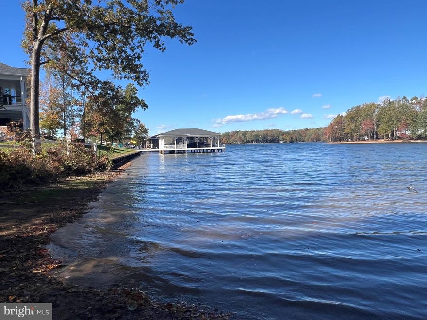 One of the last remaining waterfront lots in the sought-after neighborhood, Noah's Landing. Long views, and  100' of shoreline to build your boathouse! The community offers many amenities located on the private side of the lake (pool 3). It offers a boat ramp, basketball court, sandy beach, volleyball area, and covered picnic area.