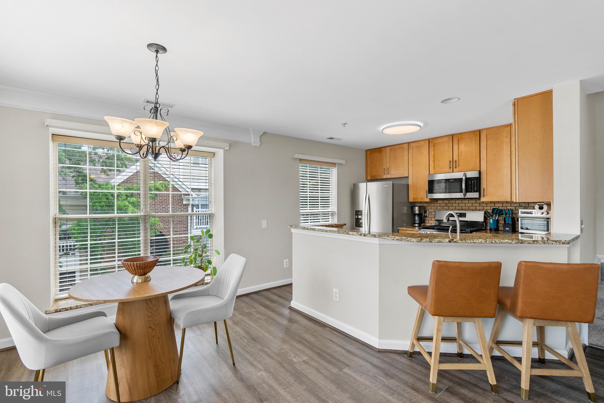 Step into this charming 2-level penthouse condo in the desirable Chatham Green community of Sterling, located in Loudoun County. Just minutes from Route 7, Dulles International Airport, and the Metro’s new Silver Line, this location offers unmatched convenience for commuters.
The main level features a fully renovated kitchen (2019) with granite countertops, stylish wood cabinetry, and newer appliances. The bright and open living area boasts LVP flooring, crown molding, a ceiling fan, and a cozy three-sided gas fireplace shared with the dining room. Step out onto the private balcony to enjoy some of the best sunrise views in the neighborhood. A refreshed powder room (2022) completes this level.
Upstairs, you'll find two spacious bedrooms with vaulted ceilings and private en-suite baths. The primary bathroom was beautifully renovated in 2018, and the second bath updated in 2020. Other upgrades include brand-new flooring (2023), a new washer and dryer set (2023), and a brand-new HVAC system installed just five months ago.
This home also comes with two unassigned parking passes for the community lot. Don’t miss your chance to own this thoughtfully updated condo in a prime location!