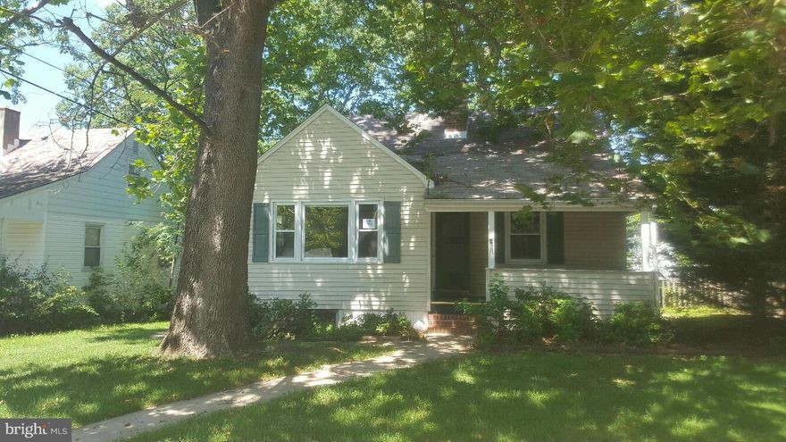 GREAT 3 BED 2 BATH IN NEED OF COSMETIC UPDATING.   HARDWOOD FLOORS.  PARTIALLY FINISHED BASEMENT WITH POSSIBLE 4TH BEDROOM AND FIREPLACE.  LARGE REAR YARD.
