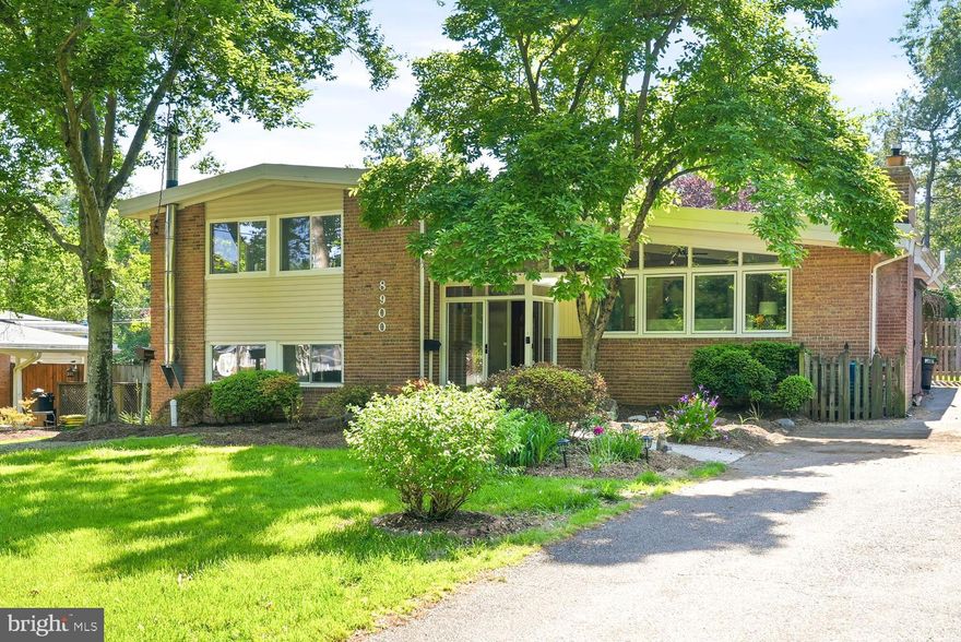***OPEN HOUSES THURSDAY AND SATURDAY**This is a mid-century gem for so many reasons! It's more affordable than Hollin Hills, but also  your dream come true if you need multi-generational living (or you love hosting friends and family when they visit DC). Courtesy of a permitted and professionally built addition, you get two fully equipped homes in one. Plus a climate controlled workshop and beautifully landscaped private back yard. Walk right in and admire the classic contemporary finishes like rich oak wood trims contrasting against crisp white walls, wood floors, a recessed gas fireplace, brick accent wall, and slanted ceiling over the open main level.  Of course sunlight streaming through large picture windows. The kitchen sits at the heart of the home, perfect for preparing a multi course meal for the back dining room, that overflows right into the gardens. Equally convenient for grabbing chocolate chip cookies the second they come out of the oven, for anyone curled up on a sofa in the front living room.Upstairs, three spacious bedrooms and a full bathroom offer so many options - one is so large and is a transition into the addition, making it a good candidate for an upper family room or oversized office instead.  The addition has its own back deck with an exterior lift from the ground, and a stunning vaulted ceiling over space for sleeping, working, lounging, even casual dining, a 2nd kitchen, lovely bathroom and laundry.  Guests, au-pair, in-laws or the one suite everyone wants. But wait, there's more!  Down one flight of stairs from the main level is a den or Rec Room perfect for game day or movie night, but also a room for crafts or exercise and yet another primary suite with bedroom, full bathroom, laundry and a walk out to the back yard. Highly sought after quiet community tucked conveniently near the scenic GW Parkway, with quick access to Hollin Hall Pastry Shop but also Costco, Fort Hunt Park, schools, hospital and historic Mount Vernon Estate. Take a quick bike ride for a picnic lunch along the Potomac River for fun, or run the trails all the way to the Pentagon. Speaking of the Pentagon, the commute to there and DC by car is just 20 minutes, with Fort Belvoir even closer!  (floor plans in photos)