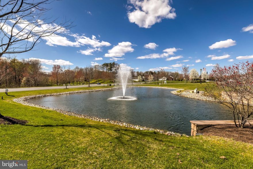 Welcome to this 2/3-bedroom 2-bath trophy in the most prized location with enchanting views of a fountain and  closest to Club House! This  captivating residence was the last built in this sought-after age-55-minimum community on THE premium, VIEW lot, that was part of the original builder's sales office. Note the sterling bones of the gracious  Captiva open floorplan, with inviting flow and NO bedroom sharing walls. The welcoming, wide foyer  leads to a formal living room, dining room and then the sunny family room.  The expansive kitchen boasts a dine-in counter PLUS a breakfast area. BONUS solarium spills onto a picturesque stone patio facing the fountain and pond.  This fabulous view is also enjoyed by the sumptuous main bedroom suite. The  front room, crafted into a library/office, was offered by builder as a 3rd bedroom.  This community is rich with countless amenities - Club House, swimming pool, tennis court, putting green, trails.. -  plus near  shops, transportation and I95! OFFERS DUE 5pm TUES 4/13. "SAMPLE" Floorplan in Documents Tab.