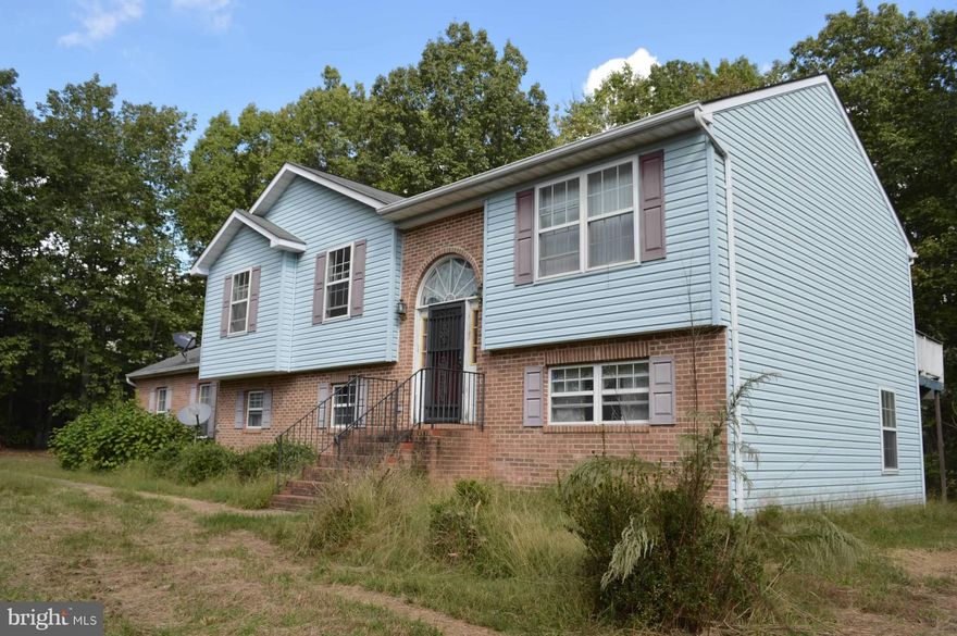 Home is listed "AS IS". Located on 3.91 acres of mostly wooded lot with a private setting. Home includes kitchen/dining area, Living room, 3 bedrooms, and family room located in basement. Please call for more information.