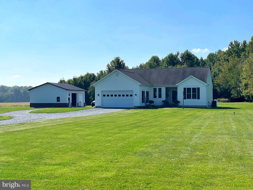 Eastern Shore Living at its Absolute Best! Meticulously maintained Three bedroom, Two bath one level ranch style home with attached two car garage on FIVE acres!  Property also boasts a 32' X 28' Detached two car garage with a workshop, two 10' doors and concrete parking pad.  The house has a split floor plan with eat in updated kitchen, large pantry and separate utility/laundry room.  Cozy living room with propane fireplace and walkout to a 20' X 16' concrete patio; perfect for entertaining!  Bright, large primary bedroom including a walk in closet and two sink primary updated bathroom with a walk-in shower.  Wildlife and wooded trails abound on this property while still offering enough open space to bring your horses and other animals.  Very close to Rt 301 for easy commuting.  Camouflaged storage container conveys to allow for maximum use of the main improvements.  Do not miss out of this one!