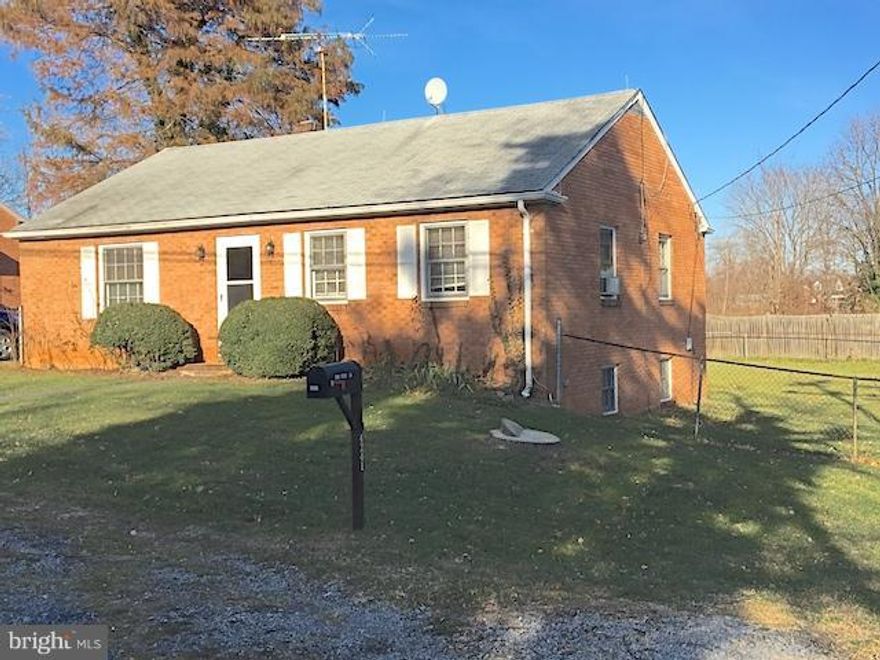 Enjoy in town living, walk to shops & restaurants w easy access to I-66.  This cute all brick home has a large fenced yard, walkout basement & huge attic storage. 3 bedrooms, the smaller bedroom off the kitchen can be used as office/dining room. You'll love the large closets, hardwood floors & built-in cabinet . Washer & Dryer included. NO smoking. Pets case by case.  Shown by appointment only.