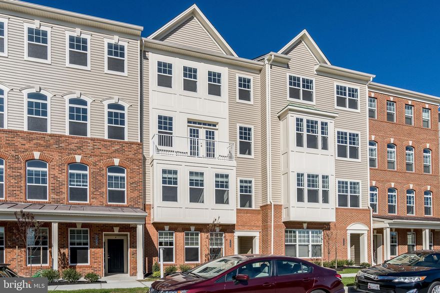 Luxury 2 level condo in sought after Oxford Square in Howard County. Featuring 3 bedrooms, 2 1/2 bathrooms, one-car garage and Private Elevator from the entry level to the main floor and bedroom floor for convenience. Entire home's  flooring is  top of the line LVP  including all stairs. Open floor plan main level is Filled with natural lighting through out the house offering, gourmet kitchen with stainless steel appliances, massive granite island and breakfast bar , open to the dining room, living room with French door to the front balcony overlooking open space of the community park and family room with built-in dry bar & access to the back deck. The upper level offers large owner's suite with tray ceiling, large custom designed walk-in closet and huge luxury en-suite spa like bathroom with double vanity, separate shower and soaking tub, two secondary bedrooms, full bath and laundry room off the hallway. Community amenities include a club house, fitness center and outdoor pool. Conveniently located near Baltimore, DC, Fort Meade, BWI and major commuting routes I-95, 295, 100, shopping, dining and entertainments.