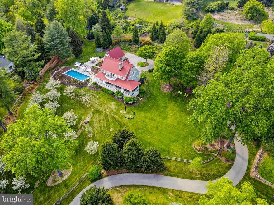 Over 3,500 square feet of living space. Modern two story single family home with lake views on beautifully landscaped 2.5 acre property with a secured fenced in yard. The home is a classic example of open concept living. A gourmet kitchen with Viking appliances is open to a cozy living and dining area with a wood burning fireplace. An expansive porch offers distant water and preserved countryside views. Relax in one of the many rocking chairs with a cool drink and good book.This home also features three large master suites with private bathrooms. One bedroom suite is located on the first floor and has direct access to a private screen porch. Two bedroom suites are located on the second floor and share a loft area and balcony. Both the first floor porches and second floor balcony overlook Loch Raven Reservoir. The lower level features a separate living space with a kitchen, family room, office/playroom/bedroom and full bath with jacuzzi tub. Outdoor amenities feature a new saltwater 16' x 42' sports pool, six person hot tub, gas fire pit and outdoor dining terrace. An additional wood burning firepit is separate and away from the pool area overlooking a generous lawn area perfect for bocci, croquet, or volleyball with lots of room for the kids to run. Convenient access is provided to Loch Raven Reservoir and the Gunpowder River with recreational amenities that include hiking, mountain biking, fishing and kayaking. A short drive takes you to several local wineries and breweries, Oregon Ridge Nature Center, Ladew Topiary Gardens, Hunt Valley Town Center and/or Towson Town Center. High speed Verizon fiber optic Wifi is available.  The house is also equipped with a Sonos sound system that includes built in speakers throughout the house and porches to hear your favorite music from your own private digital music collection. Just download the Sonos app on your phone and you are in charge of the entertainment. Furniture is negotiable. Home is currently rented throughout the summer so showing times are limited.