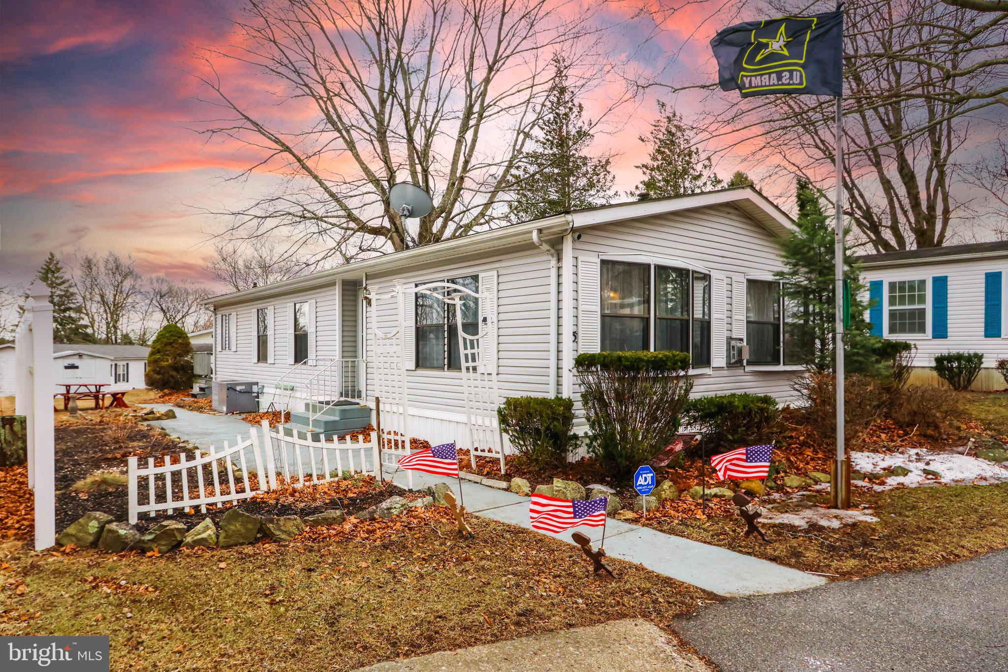 Spacious open concept home in Hickory Hills, located at the end of a cul-de-sac, with fenced privacy.
Unheard of larger yard space and peaceful backyard, with a covered deck and patio table seating area. NEW AC unit, and water filter. Spacious living room and dining room, additional built-in cabinetry, and Kitchen center island. Two large bedrooms, two full baths. The master bedroom has an en suite bathroom, cathedral ceilings, and a private door to the covered deck to enjoy your backyard privacy. Two parking spaces, and located right next to the overflow parking. Well maintained and convenient community. The lot rent is $954 which includes water, sewer and trash services along with the clubhouse, outdoor pool.