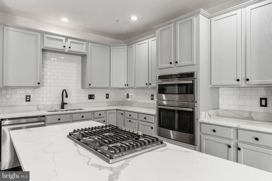 Fully Renovated Luxury Townhouse Now Available! No expense was spared upgrading this spectacular home and it is now ready for occupancy! From the gorgeous gourmet kitchen featuring all new appliances, quartz countertops, and stylish colors to the luxurious brand new master bath-not one detail has been overlooked! The entire home has been freshly painted, has new flooring,  and really sparkles from the moment you walk in! Lounge on the new composite deck with your morning coffee in the private setting that backs to woods! Extremely convenient location with easy access to major highways, Fort Meade, and the MARC train!