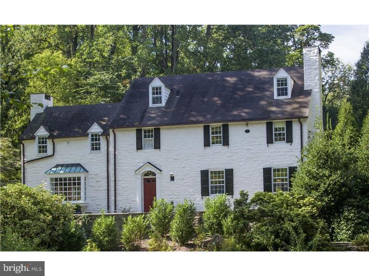 Extraordinarily renovated by Archer and Buchanan Architects and Cullen Construction, this 1930's period stone Colonial has all the wonderful elements of its period (fine craftsmanship, attention to detail, superior materials) and now an open reconfigured floorplan with state-of-the-art amenities. Its designer gourmet kitchen features: a fabulous center island with Carrera marble top; soapstone countertops on all other built-in cabinetry: and high-end stainless steel appliances. Kitchen opens to family room with wood burning fireplace and random width wood floors that continue throughout the house. All rooms are generously proportioned and sun drenched with deep window sills that look out to park like views from every room. The formal living room features a large, extended bay picture window, wood burning fireplace and granite topped wet bar w/refrigerator. The adjacent dining room has heated antique brick floors, wood burning fireplace, a solarium extension of tripartite bank of windows, and French doors to terrace and in-ground pool w/spa. There is a laundry room, powder room, hall closet and built-in library area on this floor w/back stairs to 2nd floor and basement. The front hall has a transverse staircase to 2nd floor. The master bedroom boasts wood burning fireplace, large closets, marble and tile bathroom w/heated floors, marble topped vanity w/double sinks, footed tub, and frameless shower. There are three additional bedrooms with two bedrooms sharing Jack & Jill bath and the other bedroom w/ private bath. The 3rd floor has a bedroom/office/studio w/ bathroom and provides extensive storage. The basement has a large playroom & workout area w/egress to yard. There are front and rear flagstone and brick terraces for entertaining and relaxing. Set at the end of a long private driveway on one of the most desirable cul-de-sac's on the Main Line, this property is walkable to Bryn Mawr Village and minutes away from Routes 76 & 476 and the best public and private schools in the country. Basement playrooms sq ft approx. 568 SF. Property is NOT in a flood zone.