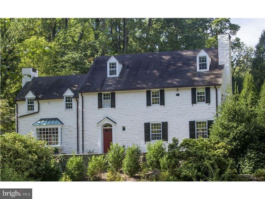 Extraordinarily renovated by Archer and Buchanan Architects and Cullen Construction, this 1930's period stone Colonial has all the wonderful elements of its period (fine craftsmanship, attention to detail, superior materials) and now an open reconfigured floorplan with state-of-the-art amenities.   Its designer gourmet kitchen features: a fabulous center island with Carrera marble top; soapstone countertops on all other built-in cabinetry: and high-end stainless steel appliances.  Kitchen opens to family room with wood burning fireplace and random width wood floors that continue throughout the house.  All rooms are generously proportioned and sun drenched with deep window sills that look out to park like views from every room.  The formal living room features a large, extended bay picture window, wood burning fireplace and granite topped wet bar w/refrigerator.   The adjacent dining room has heated antique brick floors, wood burning fireplace, a solarium extension of tripartite bank of windows, and French doors to terrace and in-ground pool w/spa.  There is a laundry room, powder room, hall closet and built-in library area on this floor w/back stairs to 2nd floor and basement.  The front hall has a transverse staircase to 2nd floor.  The master bedroom boasts wood burning fireplace, large closets, marble and tile bathroom w/heated floors, marble topped vanity w/double sinks, footed tub, and frameless shower.  There are three additional bedrooms with two bedrooms sharing Jack & Jill bath and the other bedroom w/ private bath.  The 3rd floor has a bedroom/office/studio w/ bathroom and provides extensive storage.  The basement has a large playroom & workout area w/egress to yard.  There are front and rear flagstone and brick terraces for entertaining and relaxing.  Set at the end of a long private driveway on one of the most desirable cul-de-sac's on the Main Line, this property is walkable to Bryn Mawr Village and minutes away from Routes 76 & 476 and the best public and private schools in the country.  Basement playrooms sq ft approx. 568 SF.  Property is NOT in a flood zone.