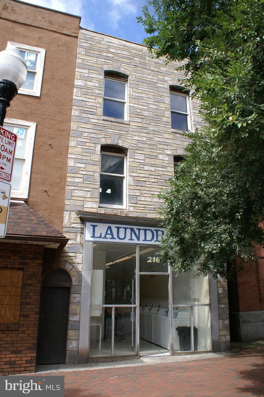 Sale includes Self Service laundromat. New owner can operate laundromat,or sell laundromat business and rent space. Many other options are available with zoning of C1 Mixed Commercial and Residential use building.Three story masonry mixed commercial and residential use building  Self-service laundromat on the first floor,1 bedroom apartment front of first floor 2nd & 3rd  available for renovation