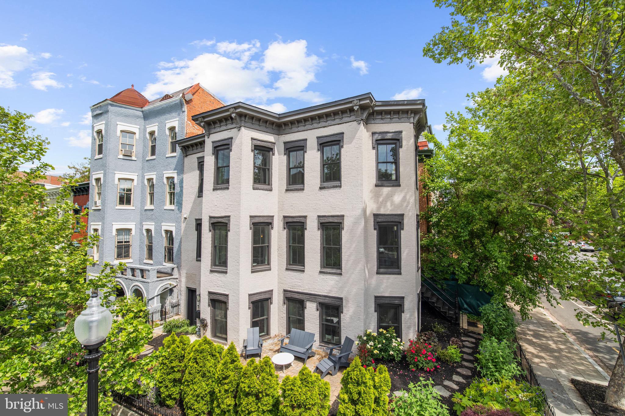 Prominently located between Logan and Dupont circles on a beautiful tree-lined street. This stunning townhome offers two separate units, sold together. Both homes feature a warm, natural color palette with top-of-the-line appliances and Waterworks bathroom fixtures. Sunlight will warm you in every room. Twenty-seven huge windows offer unique views of nature and city life. Completely restored in 2016 by Kensington, MD builder, JK Build. Enter the main residence as you are overwhelmed by the natural light, high ceilings, and an open living room and kitchen layout. Three bedrooms, 2.5 bathrooms are in the main home. Upstairs, enjoy one of the best home offices in town. Views in three directions! The master bedroom is just down the hall, connected to a luxurious spa bathroom. The rooftop terrace is perfect for entertaining. Plenty of room for relaxing, and an outside kitchen that includes a refrigerator and built-in grill.The second home offers a private entrance on Q street, Unit #1 is perfect for guest in town, or even a valuable rental unit. This two bedroom home is also drenched with light shining through nine large windows. All top-of-the-line finishes in the kitchen and bathrooms. Generate rental income or sell in the future. Both units have easy access to a front garden that has been professionally landscaped and maintained. At night the townhome shines. Professional lighting was installed by the current owner to cover the exterior walls with colorful lighting for pedestrians to enjoy. (Square foot totals provided by developer.) Please take a virtual tour using this link - Main Unit (#2) https://my.matterport.com/show/?m=B9ZQkS3hp9e. Second unit (#1) https://my.matterport.com/show/?m=aGYnfGuNrEK