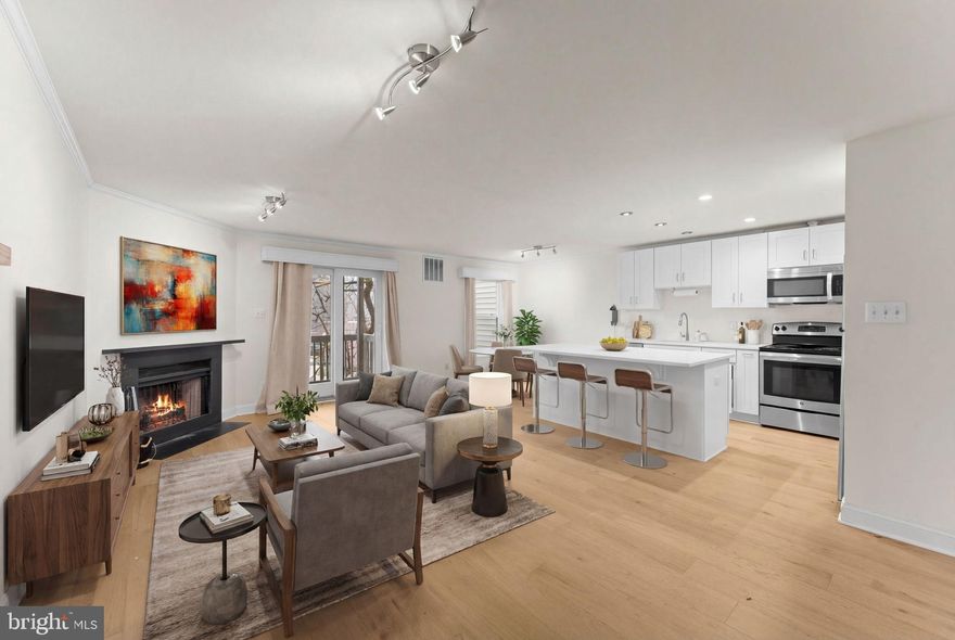 MUST SEE! Beautifully Renovated Townhome-Style 2-Level Condo in the Heart of Rosslyn. <BR><BR> 

This bright and open home features a flexible 3BR layout (or 2BR + Den) with 3 full bathrooms and an assigned parking space conveniently located directly in front of the home. The kitchen has been thoughtfully redesigned with quartz countertops, new cabinetry, and a large island that significantly expands counter and storage space, while new LVP flooring throughout gives the home a clean, modern feel. <BR><BR> 

The main level entry offers an open living and dining area, kitchen, comfortable balcony, and a versatile bedroom ideal for a home office or den. The lower level includes two additional bedrooms and direct access to a spacious outdoor deck, creating excellent indoor-outdoor living options. <BR><BR> 

Quietly tucked away yet close to everything, the location truly cannot be beat. The home is less than a mile to Rosslyn Metro and just a 20-minute walk to Georgetown, the home is surrounded by some of the region’s best trails and parks including Custis Trail, Potomac Heritage Trail, and the Mount Vernon Trail. Enjoy easy access to neighborhood favorites like Cafecito, Mom’s Organic Market, Whole Foods, Open Road, Salt, Ambar, Wagamama, For Five Coffee, and the Upside on Moore food hall. <BR><BR> 

A rare opportunity to enjoy modern updates, flexible living space, and one of Arlington’s most walkable and connected locations. <BR><BR> 

*Please note: Since photos, first level bathroom wallpaper was removed and all the walls were painted.