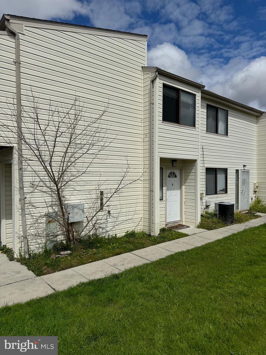 Amazing 2 bedroom 1 bath walk up 4 plex condo. Nice vinyl flooring. Brand new stainless fridge. This property has an attached shared 2 car garage were this unit owner gets a one car garage space.