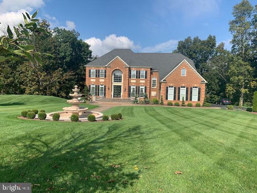 Bring all offers in!! This spectacular 2 story home is located in desirable Warner Meadows. Has a lot  to offer! Council Rock North school district! 5 bedrooms, 5 1/2 baths. This beauty has new Moroccan cherry hardwood flooring and open side by side formal living and dining area. Kitchen designed with 42' Timberlake cabinets, granite countertops, kitchen island, newer stainless steel appliances, butler kitchen and intricate iridescent glass tile backsplash. Morning sun room gives you lots of privacy. walk out to upper deck, study area, family room with custom built-in mahogany cabinetry, gas fireplace and a wall of Palladium windows overseeing a private wooded backyard. Gorgeous master bedroom suite with sitting area and well appointed private spa retreat Roman master bath. the oval center tub compliments the lavish oversized frameless dual shower and his/her vanity with entrance to dressing room with custom built-ins.  All bedrooms have lots of closet space and there own bathroom with cherry cabinets and granite countertops. Full finished basement with a home theater, living room, dining room, bedroom with full bath, built-in custom bar, French doors leading to back patio. front yard has a beautiful water fountain, Upper deck, oversized garage and much more!