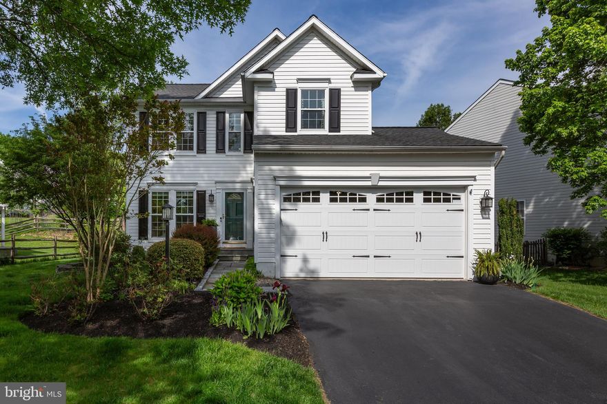 Welcome to 882 S York Drive, a stunning 3 bedroom, 2 and a half bathroom home in the highly-sought after Williamsburg community in Downingtown. With a clean and classic white siding facade, this home has a timeless curb appeal that will continue to impress year after year. Beautifully updated with an open floor plan and stylishly decorated according to today’s trends, this home is ready for you to move right in. An excellent location, Downingtown is known for its award-winning school district, plenty of popular bars, restaurants, and shopping options, several gorgeous parks and trails, and many convenient commuter options via car or train! 
As you approach the home, you’ll appreciate the community feel of the Williamsburg neighborhood, with wide streets, manicured lawns, well-cared for homes, and Williamsburg Park, which features a baseball diamond. Parking is a breeze, with a private driveway and a two-car attached garage. Enter the home and be greeted by an airy and sunny atmosphere– a result of the open floor plan. Each room transitions well into one another, creating seamless flow. The kitchen features a center island with barstools for casual dining, illuminated by the sliding door to the rear patio. The living room boasts built-in bookshelves which frame the fireplace, the ideal room for relaxation and family time. Upstairs, you’ll find the spacious primary bedroom, accented with sleek wainscoted walls, as well as a walk-in closet and en suite bathroom. Two other bedrooms and a hallway full bathroom complete the second floor. Downstairs, you’ll find the fully finished, daylight lower level, a flexible area which can be used as a home gym, hobby space, or additional living area. Finally, head outside and enjoy a lovely, landscaped rear patio with intricate stone detailing. 
Situated less than 3 miles from the Borough of Downingtown, there are endless options for shopping, dining, and fun all within your reach at 882 S York. Enjoy the beauty of nearby parks including Marsh Creek State Park and Dowlin Forge, and access to Downingtown’s Struble Trail, which connects these parks with The Ponds Park in Downingtown Borough. Commuters can take advantage of nearby major highways including the 30 Bypass, Route 100, and Route 202, as well as Downingtown Train Station, with access to the Paoli Thorndale Line (connecting you to the Main Line and Center City Philadelphia), and Amtrak (connecting you to New York City and Harrisburg). Come by and learn about all that 882 S York has to offer!