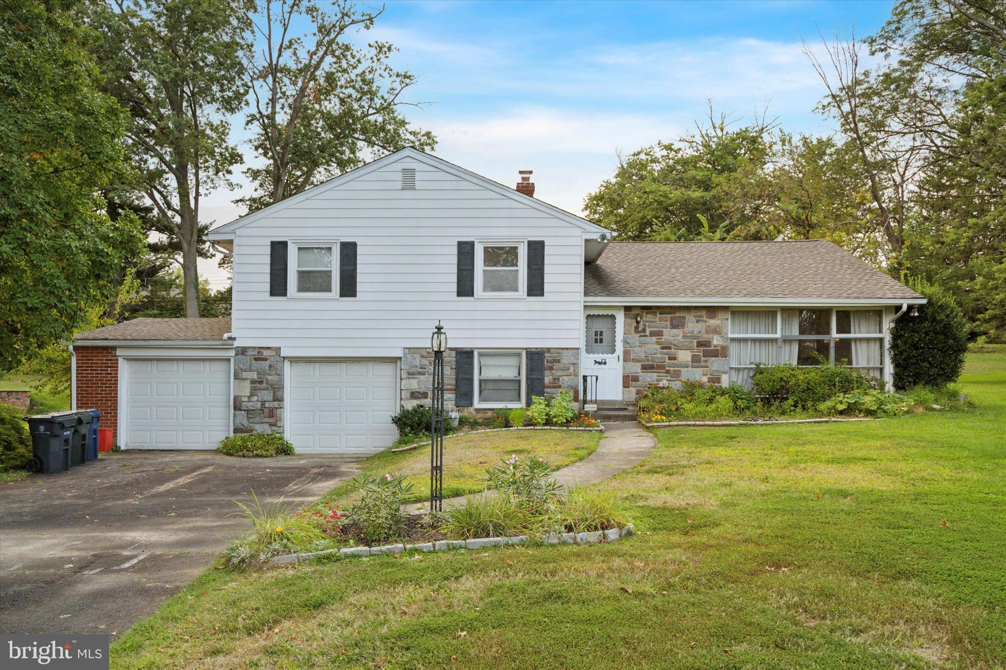 Tucked away on a quiet street in the heart of Huntingdon Valley is a single home filled with warmth and charm. This classic split-level home offers an exquisite balance of spacious rooms, fantastic flow, and utter comfort. Pull into the large driveway with an attached 2-car garage to be greeted by the beautifully landscaped entryway.
Enter through the foyer with a ceramic tile floor to the living room on your right. You will immediately notice large windows for an abundance of natural light and wall-to-wall carpeting that seamlessly flows to the formal dining room, overlooking the beautiful backyard while you enjoy everyday dinners or holiday gatherings. A large kitchen features lots of cabinets, a built-in gas range, wall ovens, and a window looking out to a gorgeous backyard while doing dishes.
The upper level has a large master bedroom with two closets and its own full bath. There are 2 other spacious bedrooms and a full hall bath on this floor.
The lower level features a family/entertaining room with access to the rear concrete patio, a powder room, and a utility room w/laundry. The roof was replaced in 2019.
This home is situated within the award-winning Abington school district and has easy access to Rt. 611, Rt. 63 (Welsh Rd), and the Rydal SEPTA Regional Station for commuting to the City of Philadelphia. It is conveniently located near shopping centers and tons of locally famous restaurants for you to enjoy.
