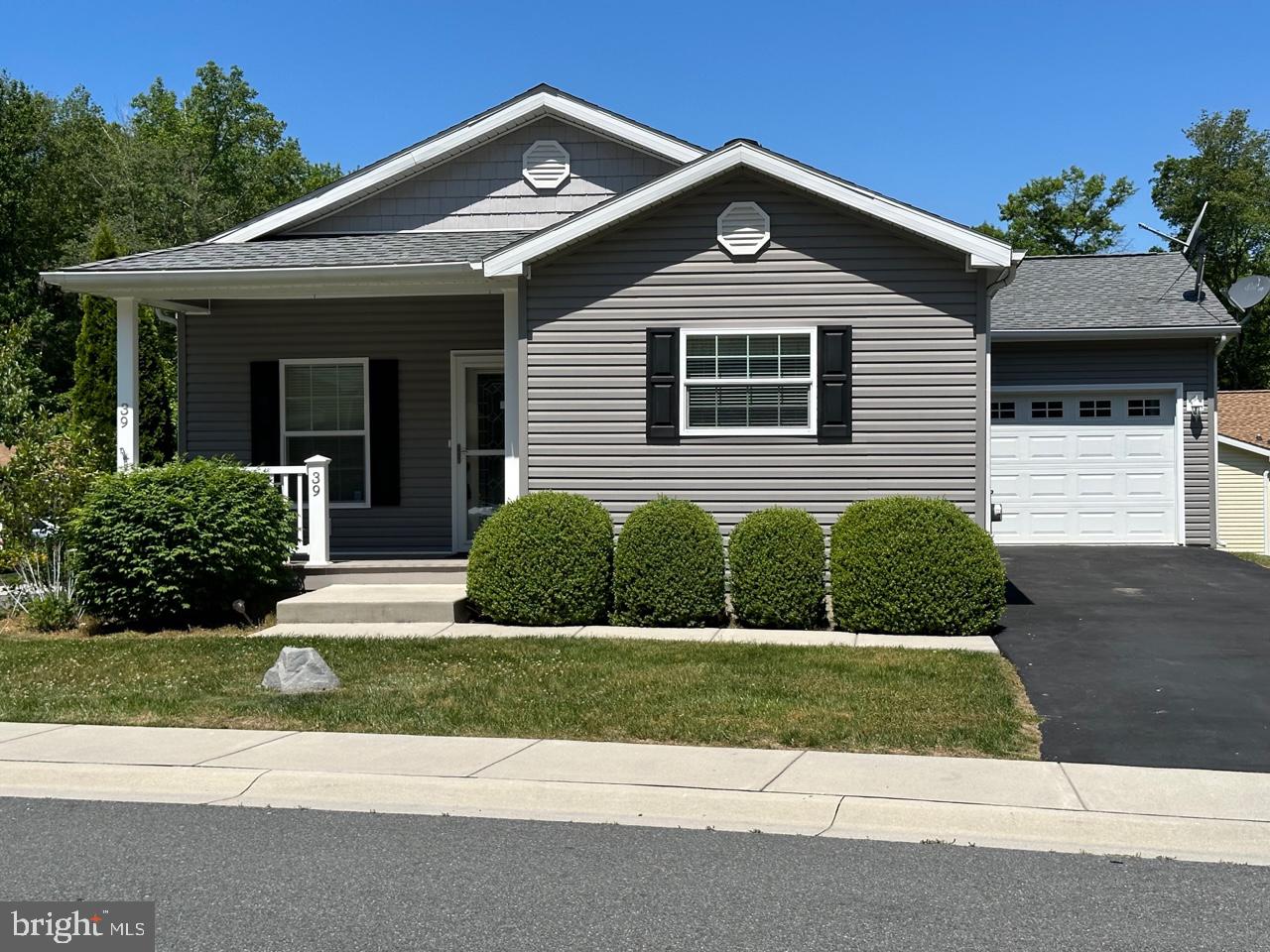 Move-in ready! Two bedrooms, 2 full bath manufactured home located in desirable 55+ community of Cecil Woods. Close to I-95, Rt. 40 and downtown North East. Kitchen has large island and stainless steel appliances, and tons of cabinets. Open floor plan that includes a sitting room and laundry. Primary bathroom features jetted tub. One car garage, covered front porch, back deck & beautiful landscaping. Community offers clubhouse that includes gathering area, exercise room, billiards, & picnic area with a pavilion. Ground rent is $533.00/month (no property taxes) that includes trash pick up, sewer & snow removal on the street. Buyer must receive park approval from Cecil Woods.