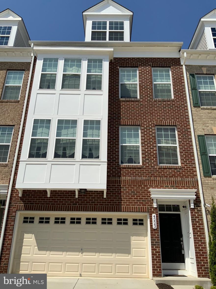 Please call 240-745-5397 for more information and not the home owner. Elegant 4 story home in well desired community. Home features 3 bedrooms, 2 full and 2 half baths.  Lovely brick front home with 2 car garage, gourmet kitchen, hardwood floors throughout the main level and stairs, spa master suite, rooftop loft and deck. Easy access to Andrews Air Force Base, minutes from DC and less than a mile from Interstate 495.  A must see!!!