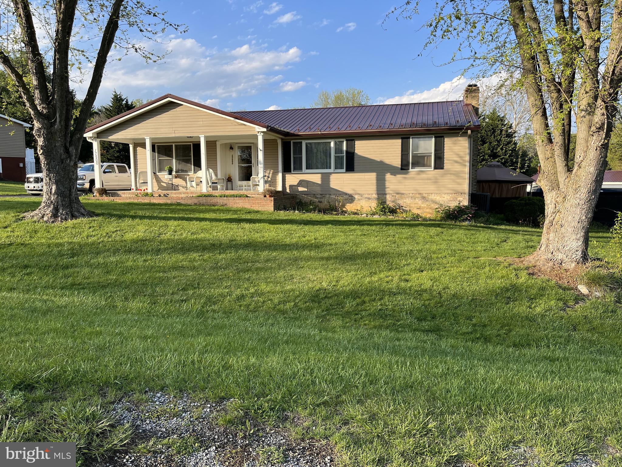 Large, truly remarkable ranch home in quaint Battlefield Knolls neighborhood. Gracious entertaining on main level that includes family room, separate dining room, kitchen, laundry, plus primary bedroom and bath plus another bedroom and full hall bath. A nearly new Trane heat pump/ac provides primary heat and ac. Electric baseboard remains usable if desired. Upscale lower level hosts a third bedroom, half bath, and fun entertaining areas--from game room (pool table anyone?) to family room with fireplace (with insert) and wet bar with refrigerator and sink. Heat and ac on lower level supplied by mini-split. Also featured are two large storage areas, A quick walk outside from the lower level to rear yard, back porch, and well-maintained in-ground pool. In addition to the pretty .8 acre property, there is a 3-car garage/workshop with electric and wood stove. Walking distance to Sharpsburg Elem. Antietam Battlefield, hand-dipped ice cream, restaurants, canal, plus other amenities close by. If you like desire a spacious home, enjoy history, and outdoor activities, this home may be perfect for you! Existing VA mortgage at 2.75% may be assumable by another eligible-approved vet to substitute for seller's VA approval.