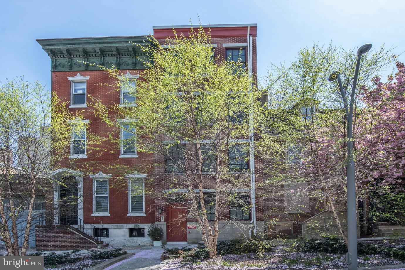 Welcome to the Penthouse, from the Rooftop deck with Stunning City & Bridge views, to the Designer Modern Finishes that wow throughout- this unit will not disappoint.  Featuring low HOA fees, two years of prepaid parking and tax abatement this is a must see.  Located in a boutique 4 unit brick building in fabulous Olde City, this oversized one bedroom plus den features 9+ foot ceilings, floor to ceiling energy-star rated windows with custom treatments, and 3.5" solid hardwood floors throughout. The entry hall offers a storage closet and modern powder room.  The Gourmet Kitchen features Porcelanosa cabinetry, quartz countertops, a large seated center island, and clean contemporary design.  The kitchen is open to the sun drenched living space two walls of windows making it a warm and inviting space.  A wide modern staircase with iron railings leads to the den/ office area where sunlight  streams through the skylight and a full size stackable laundry is tucked into a closet. The Primary Suite is luxurious and features a spa-like master bath with double floating vanity and frameless glass-enclosed shower with designer tile finishes and fixtures.  Continue upstairs to access your private roof deck- truly an outdoor oasis that must be seen to appreciate, with breathtaking views of the Ben Franklin Bridge and the Center City Skyline.  An entertainers delight - enjoy al fresco dining with a barbeque area and  bar access just inside on the same level. The sought-after Old City location is steps to the best dining, shops, attractions, as well as super easy access to public transportation on the Market Street line and I-95/76 & the race street pier.  Offered with prepaid concierge PARKING in the Parkominium a half block away for 2 Years! The entire home was decorated by an esteemed Interior Decorator and many of the furnishings are custom designed for the space and available for separate purchase.