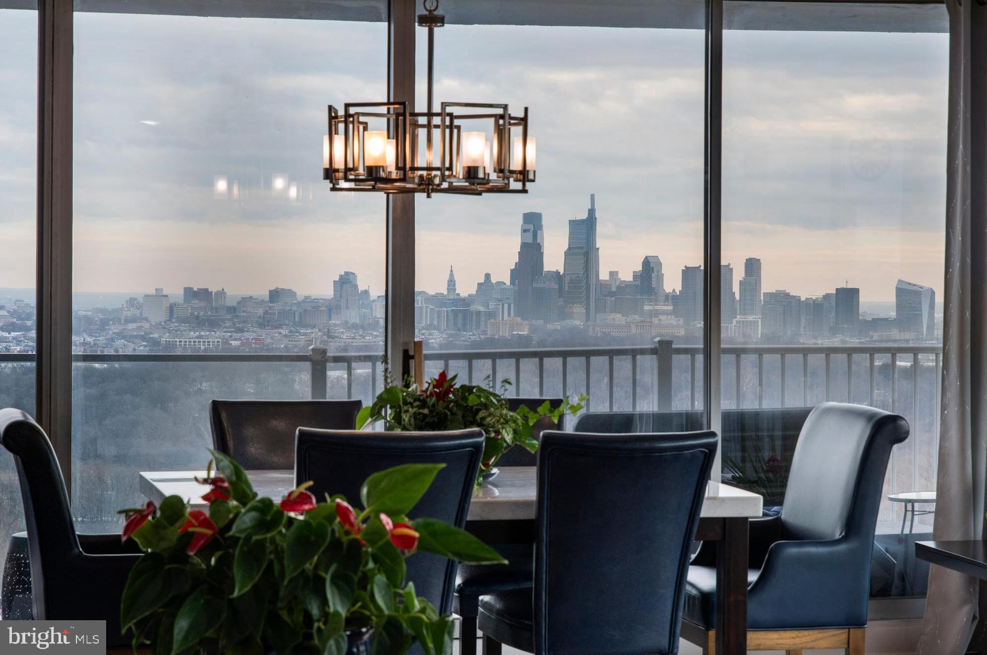 Discover the rare and extraordinary chance to live high above the iconic Fairmount Park, perched on the 20th and 21st floors of the renowned Park Plaza Condominiums. This exceptional two-story residence, #21E, offers an exquisite combination of luxury, space, and panoramic views that are second to none.
As you step into this 3,150 sq. ft. bi-level home, you are immediately greeted by jaw-dropping, unobstructed views of Center City and the lush, green expanse of Fairmount Park. The wide-open, airy spaces, floor-to-ceiling glass walls, and expansive wraparound terraces make this residence feel like a private sky-high sanctuary. The views transform with every passing season, and each sunrise and sunset paints a new masterpiece across the ever-changing landscape below. Designed with both comfort and functionality in mind, the Main Level is perfect for entertaining and daily living. The open-concept living and dining areas create a seamless flow, ideal for hosting guests or relaxing in style. Adjacent to this grand space is the eat-in kitchen, designed to cater to both everyday meals and gourmet dinners. A half-bathroom is thoughtfully placed for convenience, and a private Guest Suite is located just off the main living area, offering an enlarged walk-in closet and an en-suite bath for added privacy and comfort. The wraparound terrace extends the living space outdoors, inviting you to dine al fresco, lounge under the stars, or simply enjoy the breathtaking views. A sculptural staircase leads down to the Lower Level, providing a natural separation between the entertainment spaces above and the more intimate, private retreat below. Here, the spacious Primary Suite is an oasis of calm and tranquility, carefully positioned to frame spectacular skyline views. The suite is complete with a wall of custom-designed closets and a luxurious, spa-like atmosphere to make every moment of relaxation feel exceptional. The en-suite bath, with its sophisticated design and high-end finishes, provides a serene escape with a view. In addition to the Primary Suite, the lower level also offers one more generously sized bedroom and a full bathroom, and a cozy den. Whether used as an office, media room, or reading nook, the den provides ample flexibility for any need.
Every detail of this home has been meticulously designed to maximize comfort and style. All terraces were recently renovated with a sleek, modern aesthetic, creating an ideal outdoor living space. From lounging and dining to simply savoring the stunning vistas, these terraces offer the ultimate environment for enjoying the natural beauty surrounding the building.
This rare, two-story residence at Park Plaza Condominiums presents a once-in-a-lifetime opportunity to live in one of the most coveted locations in the city. The combination of panoramic views, expansive living space, and thoughtful design is truly unmatched, offering an unparalleled living experience that brings the best of luxury, convenience, and tranquility—all with sweeping vistas of one of Philadelphia’s most cherished parks and the bustling Center City skyline.
Enjoy all the amenities Park Plaza has to offer; indoor pool, outdoor pool, gym, 24-hour doorman and easily accessible garage parking. Utilities are included in the condo fees; electric, heat, central air, water, basic cable, 24-hour Front Desk, Doorman from 10am-8pm, On-Site Management and On-Site Maintenance. This residence has two tax ID numbers.