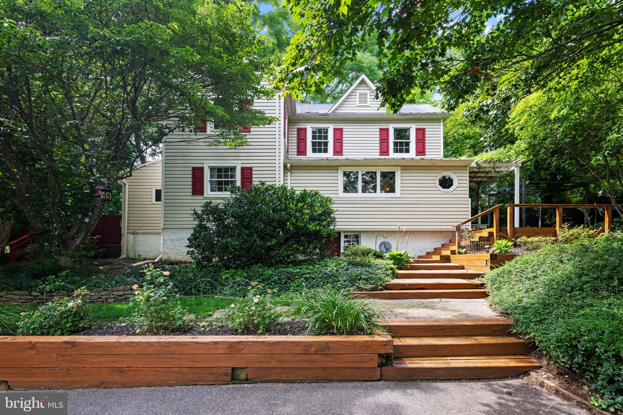 Step into a piece of living history with this enchanting 1900s colonial farmhouse, where 125 years of character seamlessly blend with contemporary conveniences. Nestled on a sprawling 1.73 acres of serene farmland, this remarkable property offers the perfect sanctuary for those seeking both tranquility and modern living.
A long, private driveway provides ample parking and is framed by beautiful landscaping and hardscaping.
Your journey begins in the stunning entryway, where Chip and Joanna would approve of the original exposed wood beams creating an immediate sense of warmth and authenticity. Natural light floods the space, setting the tone for the thoughtful historical preservation and modern updates throughout this exceptional home.
Next, step into the shared living and dining space, where custom built-in bookcases provide both storage and beauty. Recessed lighting illuminates the immaculate newly installed wood floors (2022), with exposed brick accents and a built-in window bench which creates the perfect ambiance for intimate gatherings. Hardwood floors continue into the cozy family room, complete with a vaulted ceiling, skylights, and a striking stone-accented wood-burning fireplace. From here, step through the sliding glass door onto the freshly painted deck, where a four-person hot tub awaits alongside breathtaking views of the stunning surrounding landscape. The outdoor space is enhanced by custom-built raised garden beds (2021) and a charming chicken enclosure (2021) – perfect for those embracing the homestead, farm-to-table lifestyle.
Back inside, you will find a delightful kitchen which marries rustic charm with modern functionality. Gorgeous granite countertops complement the exposed wood ceiling beams and recently installed luxury vinyl flooring (2022), while custom white cabinetry provides ample storage. A whimsical farmhouse-themed chandelier illuminates the fully equipped space with its updated, premium stainless steel appliances, including an oven range (2023), dishwasher (2023), microwave (2021), and refrigerator (2024). The kitchen also contains a laundry room (washer and dryer updated in 2022) along with a full, walk-in pantry. The first floor is thoughtfully completed with a full bath and a perfectly situated mudroom that serves as the gateway to your private outdoor oasis.
Moving up to the second floor, you will find a light-filled primary bedroom with an adjacent full bath with a jetted tub. There are also two additional bedrooms, one of which features an original exposed brick chimney. This exceptional property offers the best of both worlds – rural serenity with urban convenience. Located less than ten minutes from the quaint, award-winning main street in Sykesville, you'll have easy access to local dining, shopping, and community events. For everyday needs, convenient shopping in Eldersburg is also just moments away.
This isn't just a house – it's a lifestyle. Whether you're entertaining on the deck, tending to your thriving garden, or simply enjoying the peaceful views from your hot tub, this property offers endless opportunities to create lasting memories. So, don't miss this chance to own a piece of history while enjoying all the comforts of contemporary living. Schedule your private tour today and discover why this remarkable property could be your forever home.
