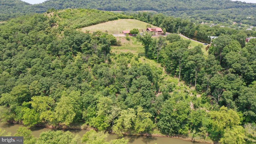 2.91 Acre building Lot conveniently located just minutes from Cumberland MD in Wiley Ford, WV with Potomac River frontage. Build your new home here with views of the Potomac River and Maryland mountains. The lot slopes towards the river and would be ideal for a home with a walkout basement. Public water and sewer hookups are available. The property has some flood zone area along the river frontage but a home can be constructed well above the flood plan.