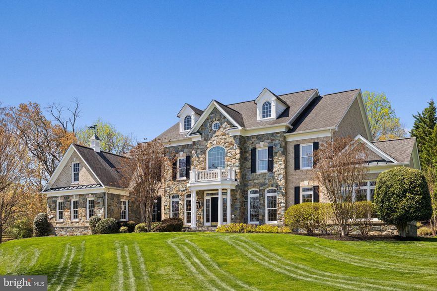 SPECTACULAR... ABSOLUTELY BREATHTAKING... RARELY does a home come along that that has been exquisitely tailored to perfection by original homeowners… Move-in ready for even the most discerning high-end buyer. Sited majestically on a 1.21 Acre cul de sac lot in the sought-after Crossings at Oakton, within easy walking distance to Flint Hill School. This exquisitely enhanced Renaissance Grand Monet has it all, including a stunning private stone terrace, gardens, a fountain and stone outdoor fireplace. Over 9,000 sf of luxury, integrating indoor and outdoor space to perfection. You are awed upon your arrival. Professional Landscaping wends along the driveway to the front garden. A bluestone walkway leads you to the elegant portico of this 4 Bedroom, 5 Full Bath, and 2 Half Bath home with 4 fireplaces! The Foyer features handsome hardwood flooring found throughout most of the main level. Everything in this lovingly manicured home has been done… from the renovated kitchen to all the bathrooms and powder rooms. Every light fixture selected with discernment. No detail overlooked. The stunning main level includes a formal Living Room and Dining Room, rich in architectural detail.  The grand formal Dining Room offers a gracious space to entertain and features stunning chandeliers and sconces.  A spectacular Sunroom is adjacent to the Living Room and is ideal for curling up with a glass of wine and a good novel. The dramatic two-story Great Room with soaring windows and floor-to-ceiling stone Gas Fireplace is completed by built-in speakers (throughout the house). It opens to the Kitchen through a Butler's Pantry outfitted with lighted display cabinetry and a wine refrigerator. The colossal Kitchen is detailed to perfection, with hardwood flooring, white soft-close cabinetry, quartz countertops, stunning marble backsplash and an enormous island with seating for 4-6 people. Appliances include Stainless Steel 6-Burner Gas Range with griddle, range hood, 2 dishwashers, door-in-door refrigerator, and under-counter microwave. A large pass-through seamlessly integrates the Kitchen with the Conservatory. A Breakfast Bar offers an ideal spot for Sunday brunch and is awash with light from 3 walls of windows. Discreetly located off the Great Room, a handsome Study overlooks the backyard and terrace. One (of two) stylishly renovated Powder Rooms is located off the gallery nook. Another family powder room is located upon entrance from the 3-car garage. The Upper-Level hallway is accessible from the grand foyer staircase and from the family staircase in the Great Room. It overlooks both the entrance foyer and the great room. The Owner's Retreat is enormous and features a generous Bedroom with deep tray ceiling, a Sitting Room with Gas Fireplace, and an elegant, renovated Bath… as well as a dressing area and 2 walk-in closets with California Closet Systems.  The Primary Bath has a free-standing soaking tub, dual vanities, a large walk-in shower with Carrera marble and multiple sprays, and a private water closet. Three auxiliary bedrooms each enjoy a private renovated bath and plenty of closet space. The Lower Level features a Family Room with Stone Gas Fireplace, a Recreation area, Game area, Guest Room/Den, Full Bath and a Playroom. Highlighting this level is an impressive Wet Bar with quartz counters and plenty of seating, and beverage fridge. A Guest Room/Den and renovated Full Bath is perfect for guests. The separate Playroom is ideal for keeping all the kids' toys at bay. Outdoors, you’ll find lush landscaping, a spectacular stone terrace with a formal garden, a stone fireplace and a fountain …providing ambiance all day and into the evening. Adjacent land around the cul de sac cannot be built on, providing complete privacy. Walk across the street to the elite Flint Hill School. Mins to I-66, Tysons, downtown Oakton & Vienna. This is the home you've earned. ... You work hard.  Isn't it time to enjoy your life?