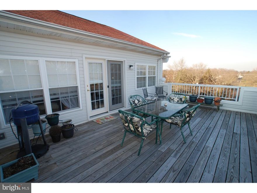 Act fast! Better than new corner top-floor PENTHOUSE in the convenient, established (no waiting for the activities to be built-no special assessments coming down the road) 55+ Centennial Station. Like a small maintenance-free rancher with a 4th floor view that no rancher could match. This home even affords you the rare creature comfort of your own private 23 X 14 roof deck-an entertaining feature that no other local active adult development offers. This one-of-a-kind Penthouse features upgrades like a kitchen island, crown molding, dry wall ceilings (as opposed to drop), custom stall shower with tiled bench seat, and ceiling fans in the great room plus both bedrooms. Activities include grand ballroom, year round 25M pool, exercise room, card rooms, tennis court, craft room, commercial center with restaurant, real estate office offering residents free notary, copying, and faxing, dentist, and beauty salon.  No dogs except service animals. Only one resident has to be 55 years old provided all other residents are over 18 years old.