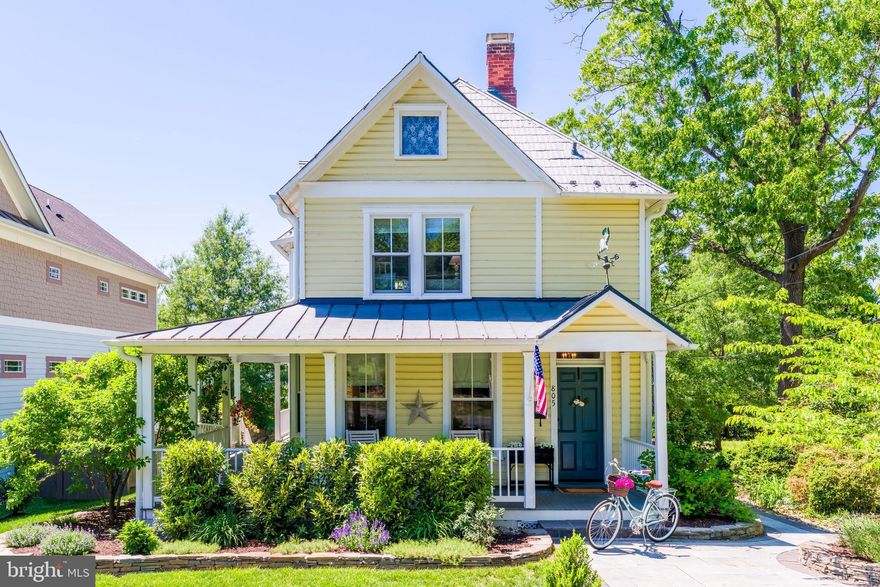 Property Collective proudly presents 805 Monroe Street — an exceptional Queen Anne Victorian in historic downtown Herndon. Originally built in 1900, every detail has been chosen to preserve its historic charm and maximize space, offering a sophisticated balance of classic character and modern updates on one of the most coveted streets in town!

This beautifully maintained and tastefully upgraded 4 bedroom, 3 full bath home features elevated finishes and designer touches throughout. A gas fireplace, custom built-ins, historic millwork, rare high ceilings, original heart pine hardwood floors, penny tile, exquisite lighting… you’ll feel the craftsmanship and quality the moment you step onto the magazine-worthy front porch.

The main level flows seamlessly between the living room, dining room and the hardworking, eat-in kitchen. Renovated in 2019 with direct access to the back deck, it is well-designed and functional for both quiet daily enjoyment and special gatherings alike. The kitchen features elegant quartz counters, two-tone cabinets, a deep farmhouse-style sink and top-of-the-line appliances including gas cooking on the Smeg range. Design elements like the smart recessed wine storage and custom wallpaper add to the high-end aesthetic that’s carried throughout the home. A stacked laundry unit and pantry shelving is tucked away behind the kitchen, maximizing the storage and utility of this part of the house.

A full bedroom — or optional office/playroom — features a built-in Murphy bed and access to an updated bathroom that features a clawfoot bathtub/shower combo, a chic nod to the home’s historic character. Continuing upstairs, you’ll find two secondary bedrooms and another updated full bathroom. The primary suite also on this level is a luxurious private retreat complete with a walk-through closet, seating area, and renovated bathroom finished with marble floors and counters, and steam shower with handcrafted Moroccan tiles.

The charm carries through to the outdoors for elevated enjoyment during every season. The warm and welcoming porch is the perfect spot for morning coffee and neighborhood meet ups. Follow the rose-draped wrap-around porch around to the expansive, breezy back deck, built in 2019. Perfect for effortless entertaining, the deck offers plenty of room to grill, dine, and connect with friends. The flat, fenced-in backyard is framed by verdant garden views, offering a peaceful and private vista. Also notable: the historically significant stamped tin roof, recently updated HVAC, bespoke windows, thoughtfully designed hardscaping, lush landscaping, and off-street parking for 3 cars. 

This home is ideally located just steps from grocery stores, local restaurants and shops, award-winning schools, a library, the historic town square and the W&OD Trail. Walk to holiday festivals and the popular Northern Virginia favorite, Friday Night Live. There is also quick access to Washington Dulles International Airport, major commuter routes, Reston Town Center, Tysons, and the Silverline Metro Corridor to DC. This is your unique opportunity to own a piece of history on one of the most desirable streets in vibrant downtown Herndon. Ready to start your next chapter here? Enjoy and welcome home!