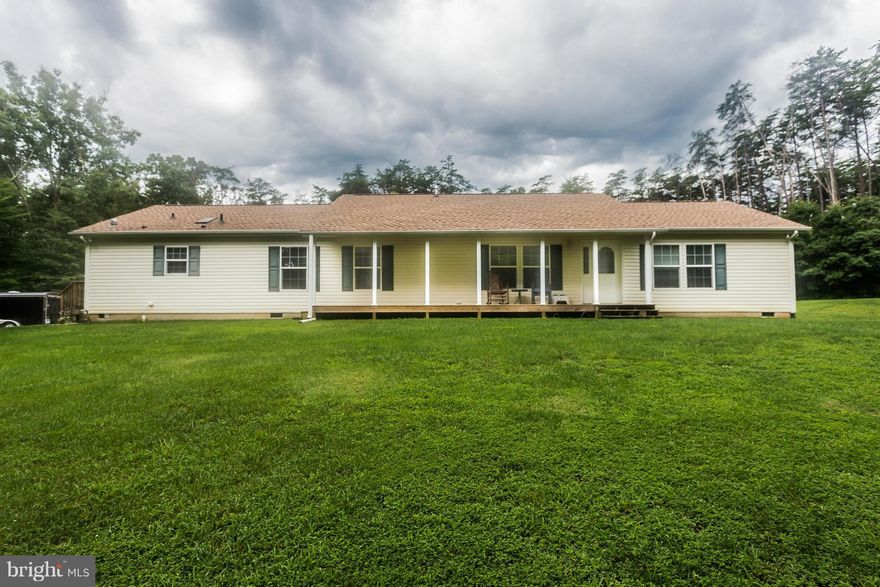 Welcome home to this spacious rambler on 12 acres. Home boasts 3 bedrooms with walk-in closets and a den. Master bath has whirlpool tub & separate shower. Large kitchen with island & breakfast nook opens to living & dining spaces and looks out onto your backyard paradise. Enjoy the tranquility from the large front porch, oversized deck, or the brand new patio. New roof 2015, water heater July 2016