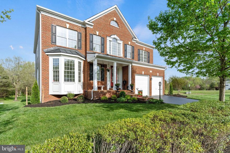 Welcome to 25758 South Village Drive in the sought-after South Village community of Chantilly—a beautifully maintained Winchester Homes (Abbey model) offering space, thoughtful updates, and a lifestyle surrounded by amenities including pools, walking trails, and tot lots.

This impressive 5-bedroom, 4.5-bath home features a functional and inviting layout with hardwood floors throughout the main level, plus hardwood flooring in the upper-level hall. The main level includes a private office with a bay window and a spacious laundry room for everyday convenience. The kitchen is equipped with granite countertops, a gas cooktop, and newer appliances (2024), opening seamlessly to the living spaces centered around a cozy gas fireplace.

Upstairs, you’ll find four bedrooms, including a large primary suite with a beautifully renovated en-suite bath, creating a true retreat. Three nicely sized secondary bedrooms are complemented by a renovated hall bath, offering both style and functionality.

Major updates provide peace of mind, including HVAC (2025), water heater (May 2025), roof (2017), and an irrigation system with newer valves and a smart controller (2024). Additional features such as wood blinds, custom shutters, and a remote-controlled foyer shade add comfort and sophistication throughout.

The finished walk-out basement (2019) offers incredible additional living space with durable LVP flooring, a full bath, a fifth bedroom, and a wet bar rough-in—ready for your personal touch. A pool table conveys, making it ideal for entertaining from day one.

Step outside to your own private backyard retreat, backing to trees for added privacy and a peaceful setting. The screened-in porch with Trex decking faces East, allowing you to enjoy beautiful sunrises with your morning coffee. To the right of the home, a convenient walking path enhances both accessibility and outdoor enjoyment.

A perfect blend of updates, space, and community—this one truly has it all.