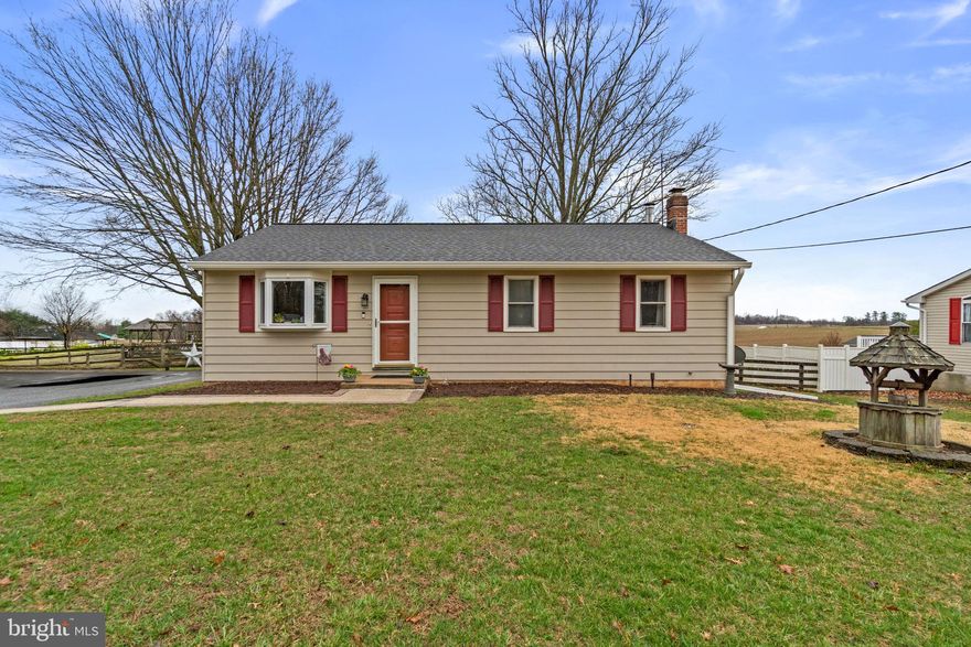 Enjoy the balance of peaceful surroundings and everyday convenience in this ranch-style home in Westminster. Offering 2 bedrooms and 2.5 bathrooms across two finished levels, the property provides comfortable living space both inside and out. The front door opens to a bright family room featuring a bay window that bring in abundant natural light along with attractive wood floors. This space flows into the eat-in kitchen equipped with stainless steel appliances, wood cabinetry, recessed lighting, and a tile backsplash.

The primary bedroom includes a large walk-in closet and an attached bathroom highlighted by a sliding barn door and shiplap accent wall. The finished lower-level family room provides additional living space that can be used for recreation, hobbies, or relaxation.

Step outside to a large wood deck and patio overlooking the level, fenced backyard, offering plenty of space for outdoor gatherings and everyday enjoyment. The yard also features two storage sheds and a fire pit. Conveniently located with easy access to Route 140 and close proximity to McDaniel College, as well as nearby dining, shopping, and grocery stores, this home offers rural living while still being close to local conveniences.