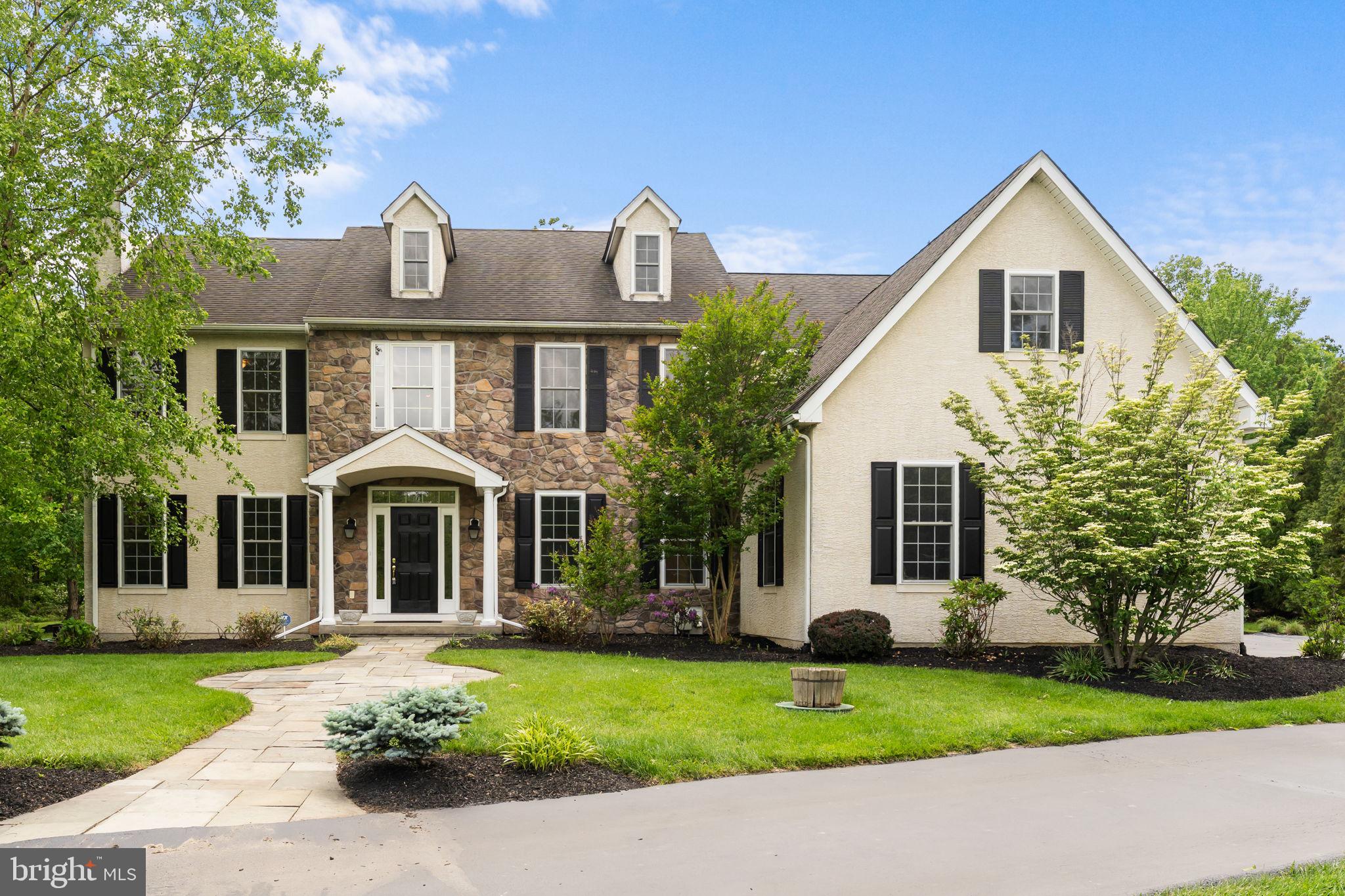 Welcome to 24 Wildwood Drive – A Rare Willistown Gem Available Immediately! Situated at the end of a quiet cul-de-sac in the heart of Willistown, this beautifully maintained home sits on a level and private 2.1-acre lot within the award-winning Great Valley School District. You are welcomed by the classic stone and stucco façade with charming shutters. Step inside to a stunning two-story foyer where gleaming hardwood floors flow throughout much of the main level. To the left, the formal living room invites you to unwind by the wood-burning fireplace, while to the right, the dining room features crown molding and chair rail accents—perfect for hosting special gatherings. The heart of the home is the spacious kitchen and great room. The kitchen is thoughtfully designed with granite countertops, a center island with breakfast bar, stainless steel appliances, and plenty of storage. The adjoining breakfast room opens to a beautiful paver patio and expansive, flat backyard—ideal for entertaining or simply enjoying the serene, wooded surroundings. The great room features a soaring vaulted ceiling and a cozy propane fireplace, making it a warm and inviting space for everyday living. A private home office, half bathroom, and well-appointed mudroom with slate tile flooring, built-ins, and access to the attached garage complete the main level. Upstairs, the primary suite is a true retreat with a tray ceiling, an expansive walk-in closet with custom organizers, and an en suite bath featuring a walk-in tiled shower, free-standing soaking tub, private water closet, and dual vanities. Bedrooms 2 and 3 share a convenient Jack & Jill bath, while bedroom 4 is served by a separate full hall bathroom. The upper-level laundry room adds everyday ease with built-in cabinetry and a laundry sink. The finished lower level provides flexible space for a home gym, recreation area, or media room—and includes a temperature-controlled wine room for the enthusiast. You'll also find ample unfinished storage and a convenient half bath. Ideally located just minutes from Malvern Borough’s charming shops and restaurants, with easy access to major routes and the Paoli Train Station, 24 Wildwood Drive offers the perfect blend of privacy, comfort, and convenience. The Don’t miss this move-in-ready home with a generator for peace of mind in one of the area’s most sought-after locations—schedule your private tour today! Stucco report is available.