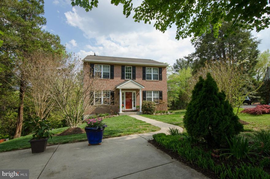 Handsome brick front colonial built 2001 situated at at end of cul-de-sac. Gracious formal rooms w/hardwd flrs & crown molding, FR with gas FP opens to Kit w/stainlss appls, granite counters & island w/access to 20 'x 20' deck w/gasline for grill. MBR suite w/walk-in closet & lux marble MBA w/jetted tub & sep shower. LL w/Media Rm, Rec Rm, Ofc, fullBA & walk-out to large level play yard & gardens.