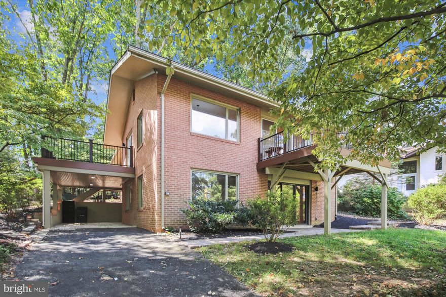 New Price! Contemporary Home in Sought-After Lake Anne!
Imagine waking up every morning in a 4BR/3BA light-filled contemporary home situated on a cul-de-sac across from Lake Anne. This mid-century modern home is approximately 3,000 sq. ft. of finished living space on two levels. Beautifully maintained, this residence features a kitchen with wood cabinets, stainless steel appliances, granite counters and ceramic tile flooring. Hardwood floors span the entire main level. Two brand new decks offer ideal outdoor spaces for relaxing or entertaining. The house offers 4 spacious bedrooms (2 bedrooms on the main level and two bedrooms on the lower level) and three full baths with designer ceramic tile and modern fixtures. The entire interior has been freshly painted and new light fixtures have been installed throughout. The lower level includes a utility room, storage, full bath and large rec room with wood burning fireplace. There are sliding glass doors in the rec room that open to a patio and exit to the outside. The lot has been newly manicured to enhance curb appeal. The property is located on a ¼ wooded lot with seasonal lake views. The neighborhood is a vibrant community with access to a pool, tennis courts, park, walking trails and use of the lake. Walk to Lake Anne Plaza and waterfront dining, coffee shops, local retail and weekly Farmers Market. Reston Town Center is 2 miles away. and Wiehle Silverline metro station is just one mile.