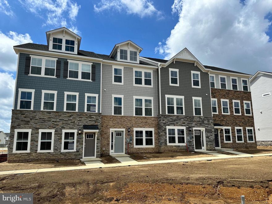 Welcome Home to the Ellicott Townhome with Detached 2-Car Garage St Charles - Highlands White Plains MD

Designed with both family living and entertaining in mind, this beautifully crafted three-story townhome offers space, style, and functionality in every corner.

The striking stone exterior adds a touch of modern charm, while inside, the first floor welcomes you with a flex space and recreation room with access to the backyard—perfect for play, guests, or a home office.

Upstairs, the open-concept main level features a spacious family room, gourmet kitchen with a stainless steel French door refrigerator, cooktop, double wall oven, dishwasher, and microwave, plus crown moulding and elegant finishes throughout. The dining room flows seamlessly onto a 20' x 10' composite deck with vinyl rails, creating the ideal indoor-outdoor experience. Wide plank flooring runs throughout the lower and main levels for a sleek, cohesive look.

Enjoy the convenience of a detached two-car garage, plus additional driveway parking for two more vehicles.

The third floor is home to all three bedrooms, including a primary suite with crown moulding, tray ceiling, a walk-in closet with natural light, private water closet, dual vanities, and a spa-inspired shower with built-in bench—your personal retreat after a long day.

Lennar proudly honors Hometown Heroes by including a washer and dryer in the upper-level laundry closet, making everyday living even easier.

Fun for the whole family starts in the heart of the home: the chef-inspired kitchen makes meal prep a joy, while the spacious bedrooms and smart layout offer room for everyone to relax and recharge.

Note: This home is MOVE IN READY! Contact the Lennar Sales Consultant to for more information regarding the builder’s 7/6 ARM eligibility as low as 3.99%. Pricing and features are subject to change. Model photos shown for illustration purposes only.

Schedule your private tour today or visit us during our Weekend Open House hours to explore the model in person