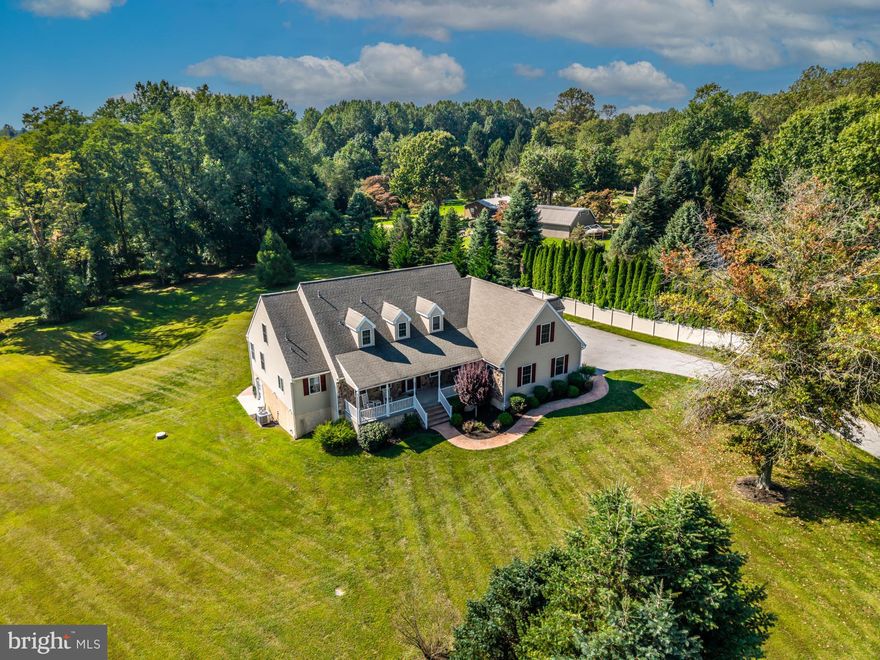 Welcome to 1657 S. Glenside Road — a spectacular 4.16-acre estate offering a rare blend of land, privacy, character, and extraordinary living spaces. If you’ve been searching for a property with acreage, a beautiful home, and an 1800s bank barn fully restored for modern use, your search ends here.
The bank barn is a showpiece: metal roof, 2–3 bay garage/workshop, and an upper level with incredible storage plus finished square footage — perfect for a studio, hobbyist space, or future conversion.
Step inside the home and you’re welcomed by a charming covered front porch with ceiling fans and timeless curb appeal. The two-story foyer opens to a semi-formal dining room on one side and a main-level bedroom or office with an attached full bath on the other.
The heart of the home is the dramatic two-story family room, filled with natural light and featuring a fireplace and French doors to the expansive decking, above-ground pool, and peaceful outdoor views. The open kitchen offers abundant space, sliders to the deck, and a cozy adjoining sunroom you’ll love year-round. A laundry room and mudroom connect the side door and the oversized attached two-car garage.
The main-level primary suite provides convenience and comfort with a full en-suite bath, walk-in closets, and sun-soaked windows.
Upstairs, a spacious loft provides flexibility for a gym, playroom, office, or lounge. You’ll also find two generous bedrooms, a full hall bath, and an almost-finished bonus room with electric, HVAC, already in place — perfect for a future home theater or creative space.
A full walkout basement, already plumbed for a bathroom, offers endless possibilities for expansion.
This remarkable property truly has it all — land, charm, a stunning barn, flexible spaces, and a layout designed for both comfort and entertaining. Opportunities like this are rare. Schedule your appointment today!