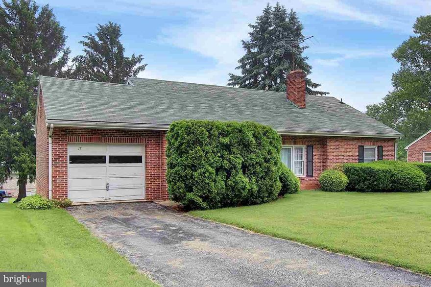 All brick rancher with hardwood floors and fresh paint throughout.  Sits on one of the side streets in Stewartstown with nice homes all around. Bedrooms are all nice size with HW and living room has wood burning fireplace.  Basement has a walkout and is just waiting to be finished with a den or family room.