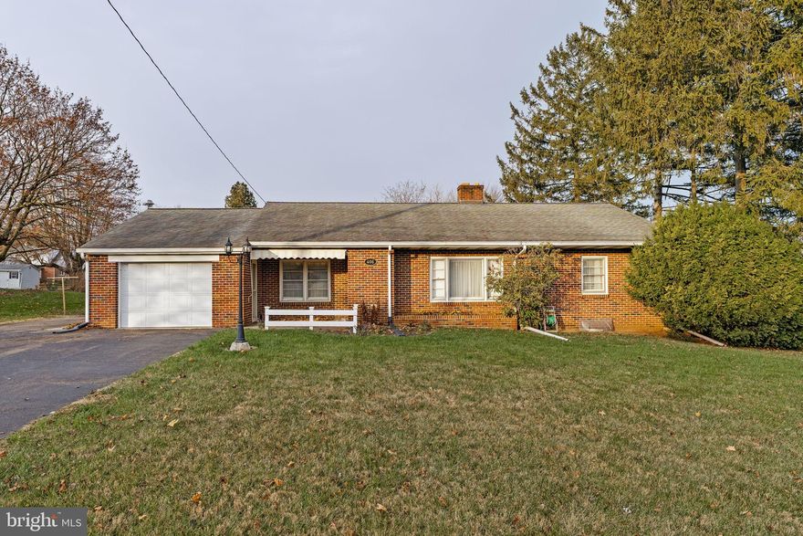 One level living.  Solid Brick Rancher in "MOVE IN CONDITION".  Oak hardwood flooring, plaster walls, tasteful interior decor.  Economical gas heat.  Central Air (new in 2024).  Large future family room 13x33 with Fireplace in lower level plus separate shop 13x33.  Convenient location minutes to everything.  Economical and  reasonable taxes.