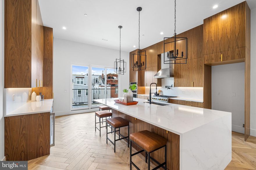 ** 1236 is Under Contract pre-construction ** ONLY TWO LEFT ** Welcome to the development of Oxford Commons, 1236, 1238 and 1240 E. Oxford Street. Introducing three extraordinary new construction homes, located on a quaint street, right in the heart of Fishtown. Rare ** FULL 10 YEAR TAX ABATEMENT ** is offered with these homes. Featuring breath-taking finishes, 2 Car Garage Parking and multiple outdoor spaces. Location. Location. Location. Savor the wealth of restaurants, bars, cafes, lounges, shops, gyms and the entertainment of Frankford Avenue. Take a quick walk over to the waterfront for parks and entertainment. Quick walk to enjoy even more restaurants and entertainment in Northern Liberties and Old Kensington. For transportation: In close proximity to Highway 95, Ben Franklin Bridge, Betsy Ross Bridge, Philadelphia International Airport and the Market-Frankford Blue Line (to Old City, Center City, 30th Street Station, University City, West Philly and Northeast Philly). A private driveway leads you into your generous two car garage. Easily park two cars side by side, with 220 volt line for your Electric Vehicle charger and space. As you enter inside, the first floor boasts 10 foot ceilings. A mudroom awaits with washer and dryer and full storage. Down the hall is a spacious bedroom and a jack n jill full bathroom. Downstairs is a fully finished basement with a bedroom, full bathroom, and a media room/office/ playroom/storage/for your imagination. Second floor greets you towering 12 foot ceilings and marvelous herringbone hardwood floors. The sizeable custom, gourmet kitchen is furnished with walnut or white oak flat panel modern cabinetry, extending up to the ceiling, luxury Monogram appliances, stone countertops, large island, with plenty of seating. The abundance of natural light permeating through the sliding patio doors, allowing you grill outdoors with ease; enjoy your morning coffee, etc. Vast dining and living space allow for entertaining with ease. The living room with oversized windows and gas fireplace is spectacular. The custom steel stringer, oak tread staircase leads you up to the third Floor. The 11 foot ceilings guide you to the bedroom in the rear, great for a home office, gym, nursery, etc. Modern hallway bathroom is adjacent to the bedroom. Yet another laundry room, conveniently located near your luxurious primary suite. Entering into your grand suite, you'll be pleased with 2 walk-in closets, a grand bedroom drenched in sunlight, and a stylish bathroom. The bathroom is furnished with 9 foot double vanity, private toilet closet and an immense walk-in shower with high-end tile selections, dual shower heads, dual rain head and wands for a true spa-like experience. Escape to the vast roof deck, unlike many you have seen in the city of Philadelphia, with unobstructed views of the center city skyline. Buyers are responsible for verifying taxes and square footage. The square footage per plans including the basement is 4,352. Please reach out for the spec package and further details.