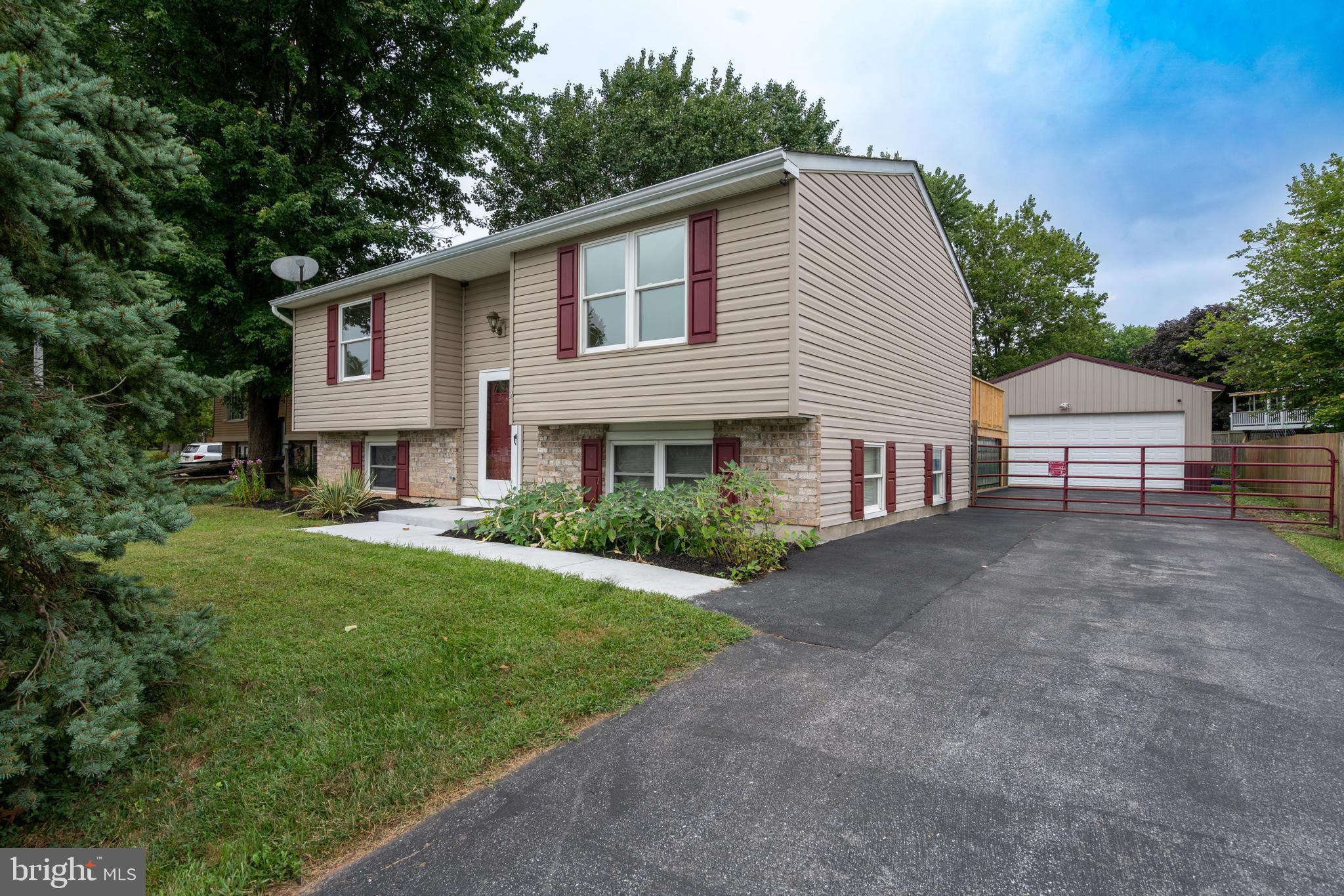 Welcome to your new home in Taneytown’s Wheatfields neighborhood (USDA eligible)! This 4-bedroom, 2-bath split foyer has a great layout and is move-in ready, with fresh paint and durable ceramic tile and laminate plank flooring. The main level has an open living room that flows to the eat-in kitchen, two bedrooms and full bath with tub shower. The lower level features a cozy rec room—perfect for movie nights, play space, or trophy room—two bedrooms and a full bath with stall shower. A separate laundry room has cabinets and counter space, and leads to the back yard. Step out onto the brand-new, extra-large deck and enjoy your private backyard—perfect for BBQs, parties, or just relaxing. The roomy driveway leads to a detached shop with tons of space for projects or hobbies. Recent updates include 2022 HVAC and water heater, plus a 2015 roof. Quiet neighborhood, yet close to town amenities and commuter routes—this home really has it all!