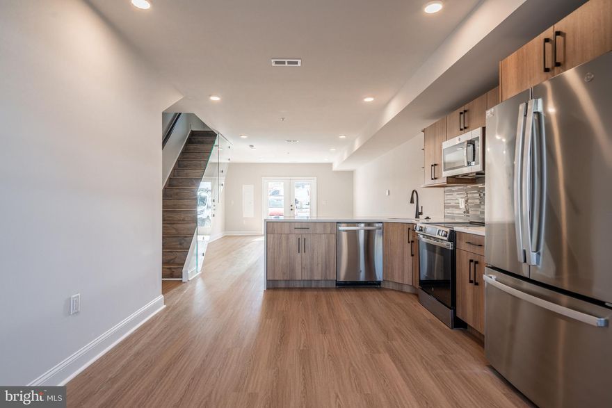 *HOMEBUYER LOAN PROGRAM OFFERING 100% FINANCING, $5,000 LENDER CREDIT AND NO PMI.* 
Welcome to your dream home nestled in the private community of Wynnefield Heights Square. This chic residence boasts 2 spacious bedrooms and 2 modern bathrooms, all enveloped in the comfort of an energy-efficient HVAC system. Step inside to find a meticulously crafted kitchen featuring Quartz countertops with a waterfall edge, Stainless steel appliances, and under-cabinet lighting - bringing warmth and functionality to your cooking space. Natural light floods the space, highlighting the thoughtful details like wood baseboard molding, glass railing, and high end vinyl flooring. The cozy patio off the dining room will serve as serene spot for your morning coffee or evening glass of wine. The chic exterior combines brick and standing seam metal on the mansard roof, enhancing the building's charm and curb appeal. Fully approved 10-year tax abatement promises affordability. Assigned outdoor parking is available for $30,000, ensuring your vehicle's security just steps from your door. Available Summer  2026. Your oasis in Wynnefield Heights Square awaits. 

PHOTOS ARE OF AN IDENTICAL UNIT IN THE DEVELOPMENT.