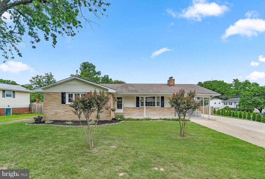 Don't miss your chance!  This stunning home has been lovingly updated and meticulously maintained top to bottom!  Charming rancher on a corner lot offering 4 bedrooms 2 full and 1 half bathrooms, all updated. Brand new designer inspired farmhouse kitchen.  New flooring throughout, fresh designer neutral paint and updated lighting.  Lower level has spacious rec room, private bedroom, spacious laundry room and rear yard exit.  Bonus covered porch off the side with ample parking in the driveway.  Easy commuter access, close to shopping, dining and entertainment! One year home warranty included.